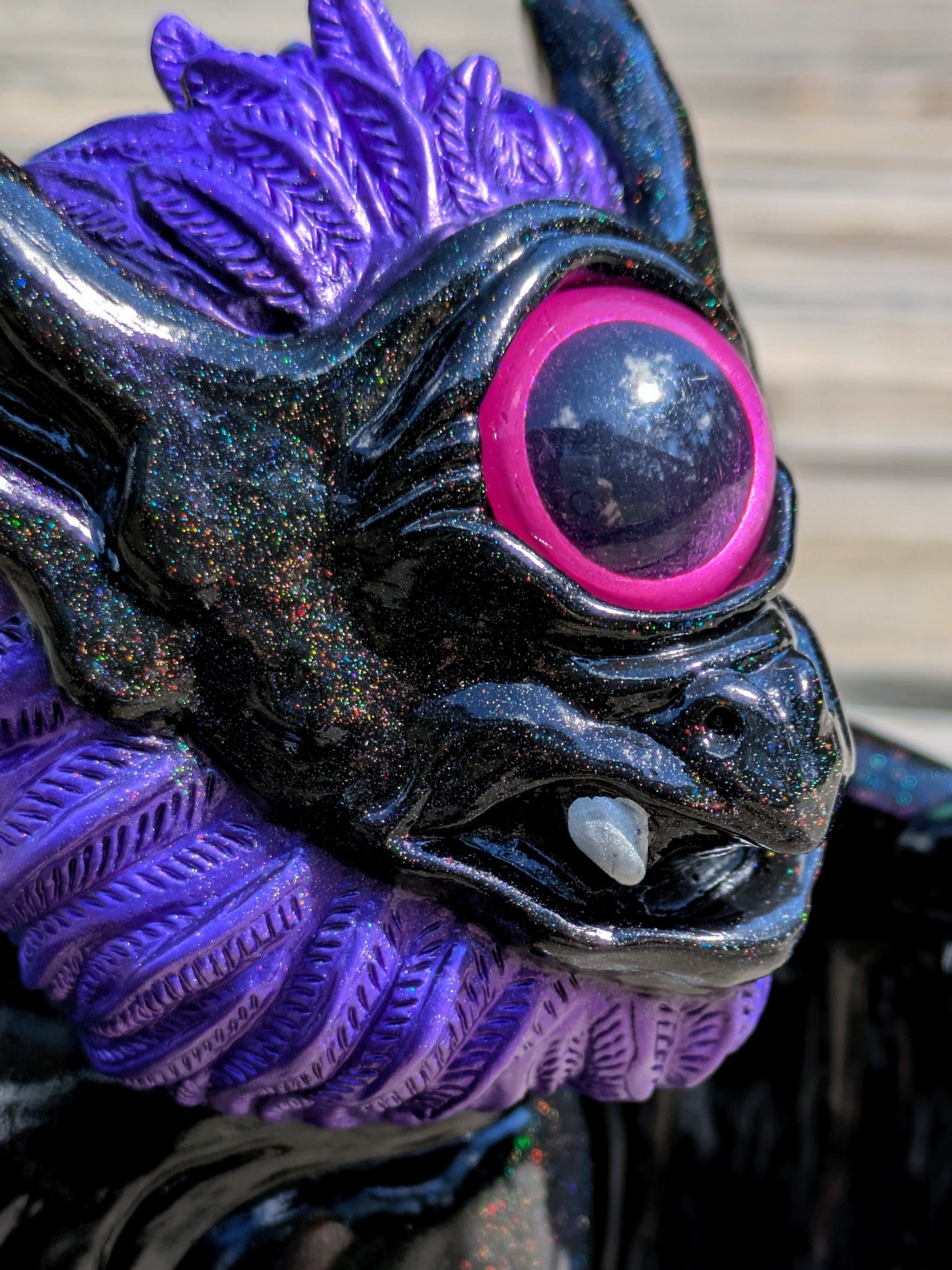 Present Sorcery - Goblidon by Wonder Goblin: A glossy, glittery toy figure with a purple mane, single large eye, and horns. Comes with a toy pouch.