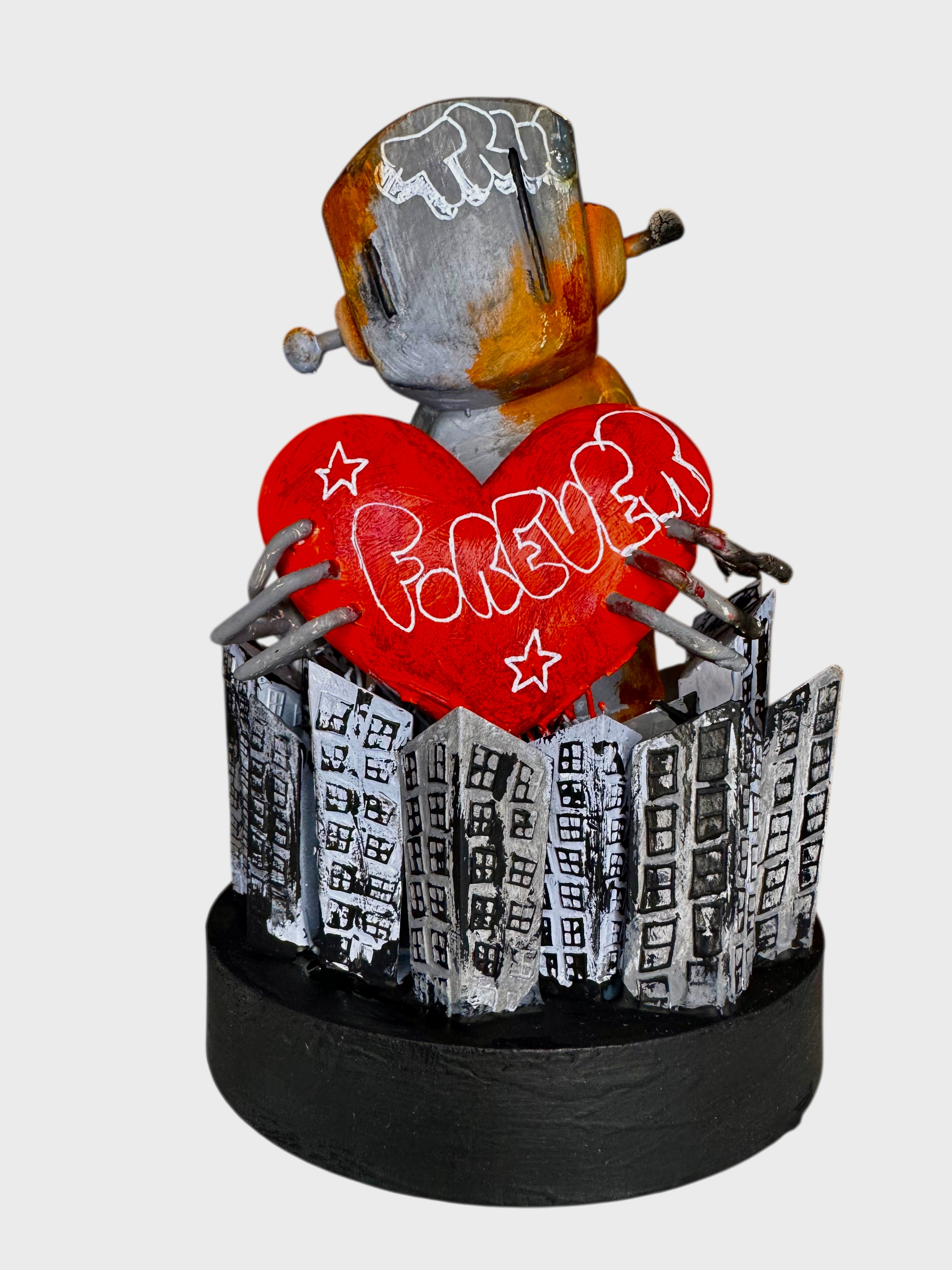Time Will Tell - Still standing by Chris RWK: Handcrafted resin sculpture of a robot holding a FOREVER heart, surrounded by cityscape cutouts, on a black base.