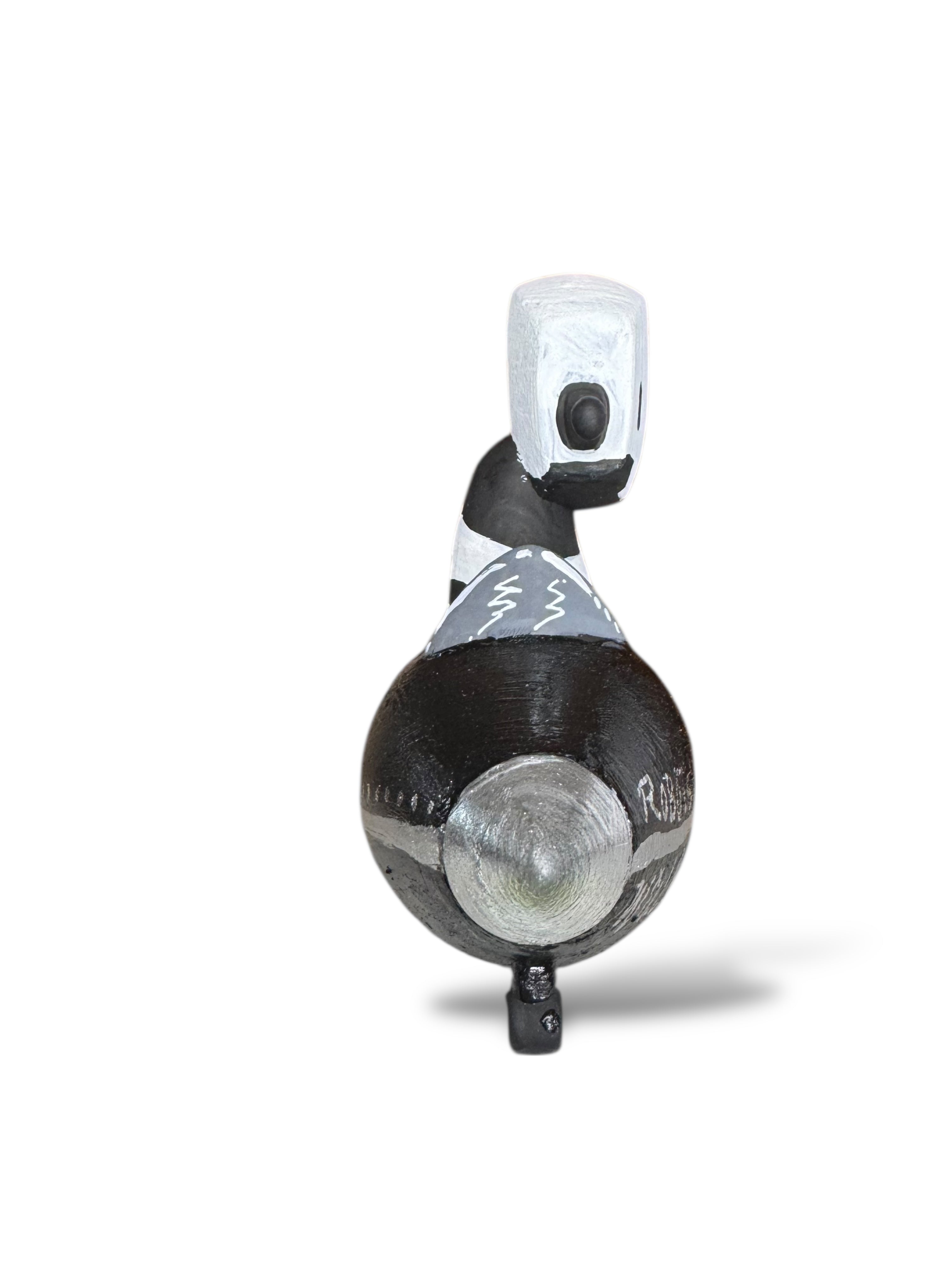 Time Will Tell - Rocket robot series 'Into the void' by Chris RWK: A stylized bird figurine with a black body, silver patch, and white head.