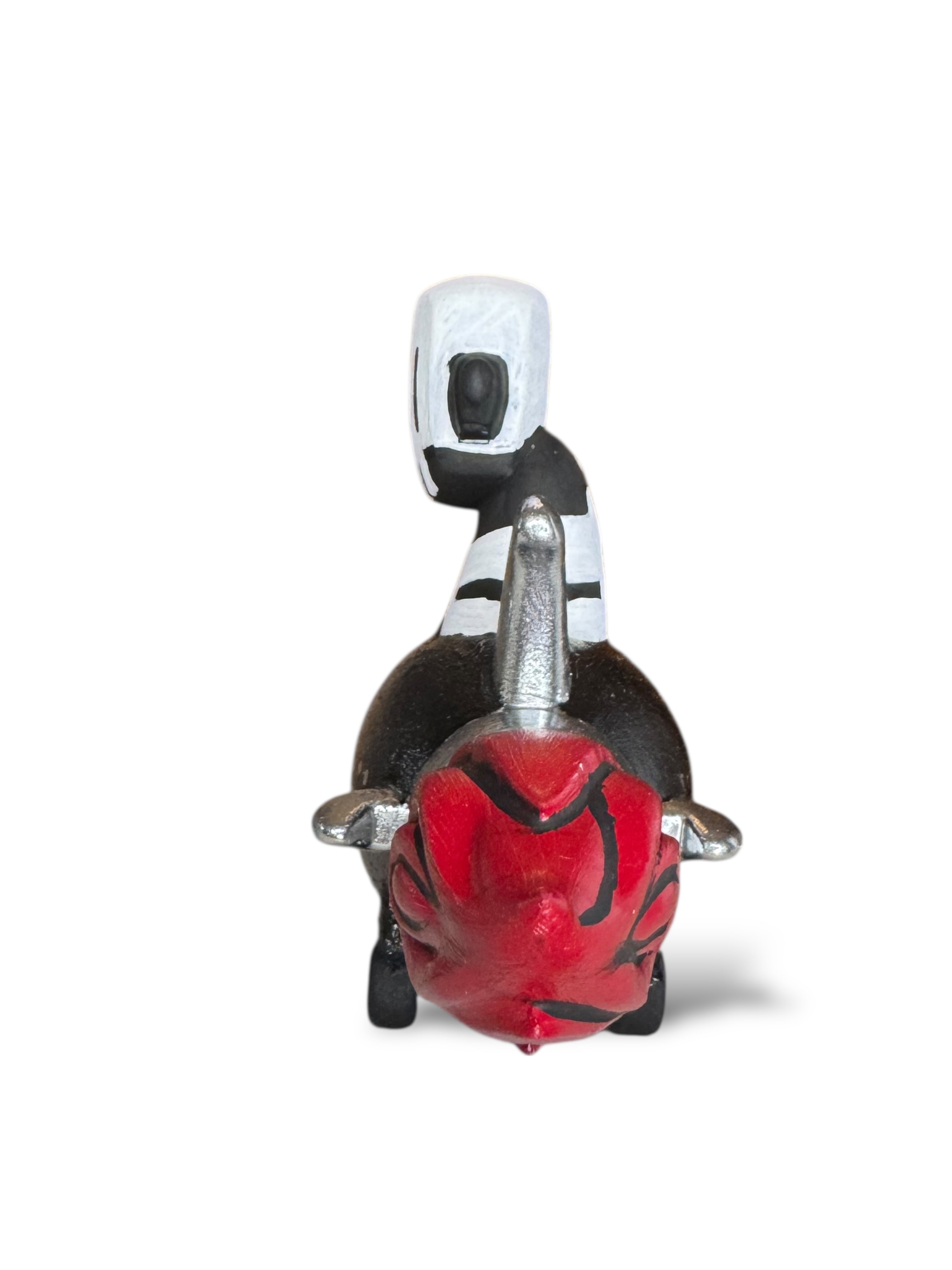 Time Will Tell - Rocket robot series Into the void by Chris RWK: Decorative bull figurine with red head, silver accents, and striped saddle, showcasing mixed media artistry.