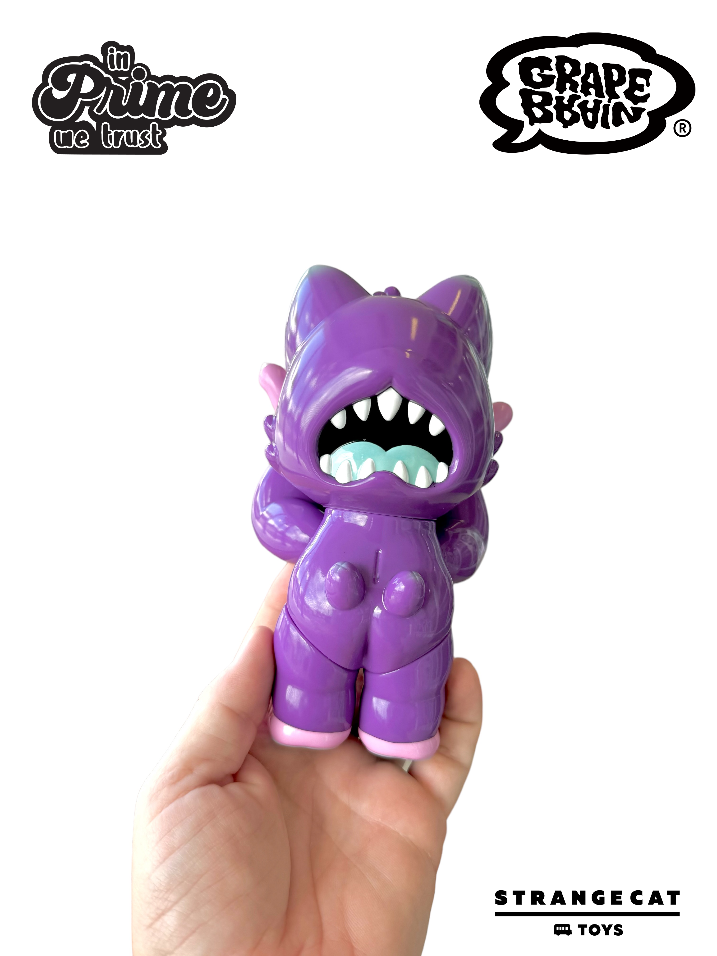 Hand holding a 6-inch soft vinyl Grandpa - Arlo Edition toy by Grape Brain x Prime, featuring an open mouth with white teeth. Limited to 100 pieces.