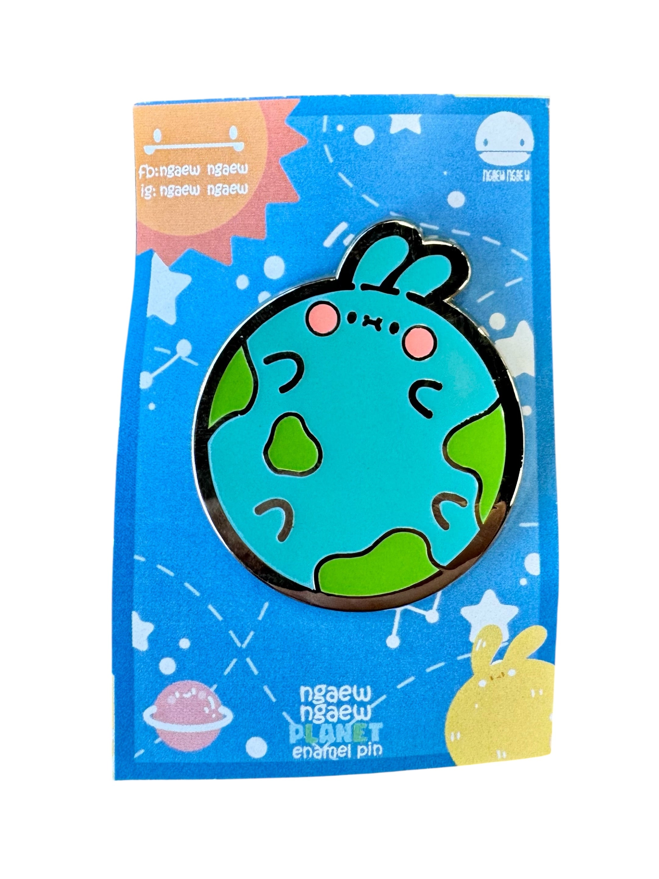Ngaew Ngaew Planet Pin features a kawaii-style planet with bunny ears on a starry card, perfect for fans of quirky, art-inspired collectibles.
