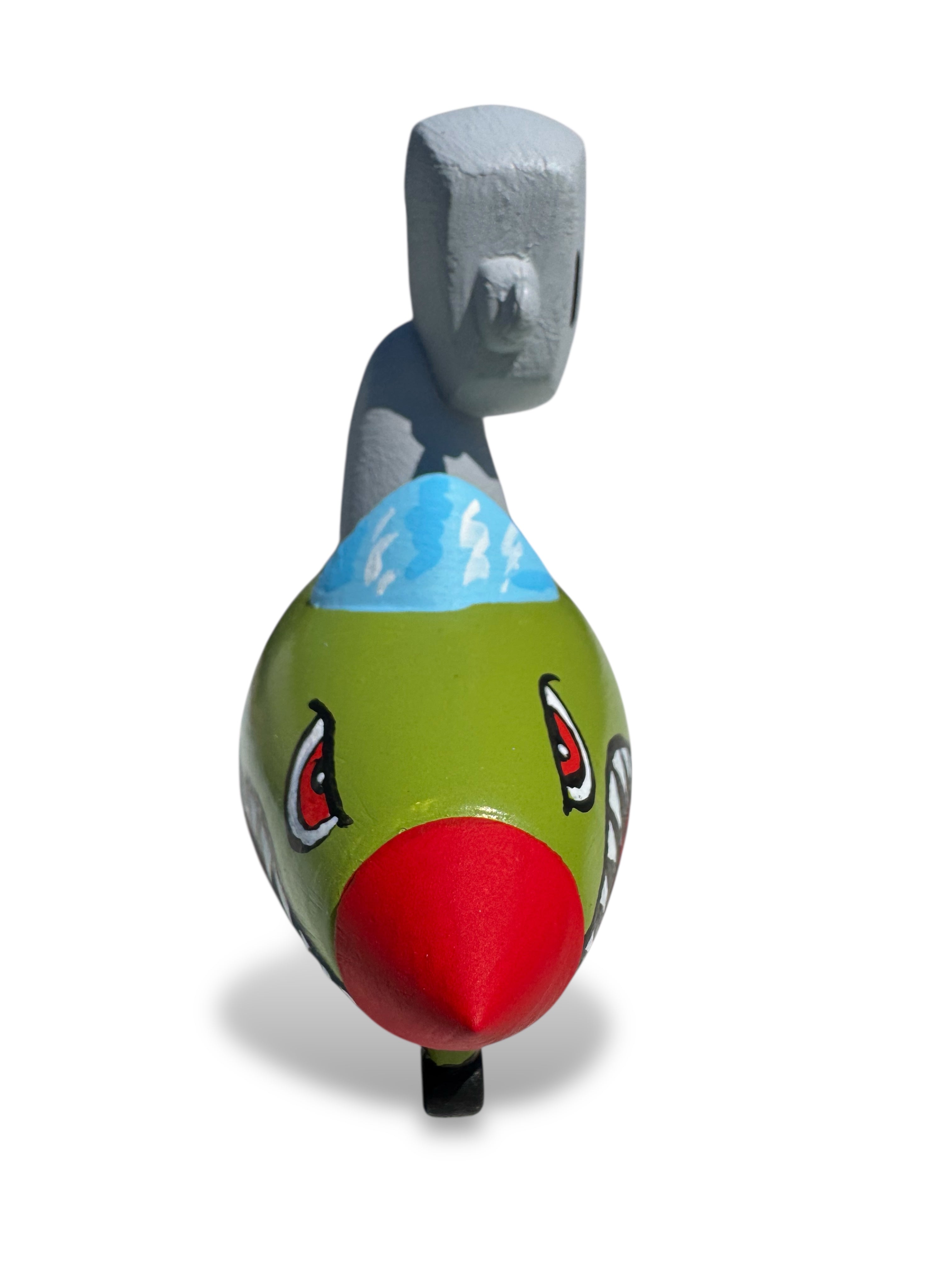 Time Will Tell - Rocket robot series Dog fight by Chris RWK features a whimsical, hand-painted creature head sculpture with a red conical nose and toothy grin.