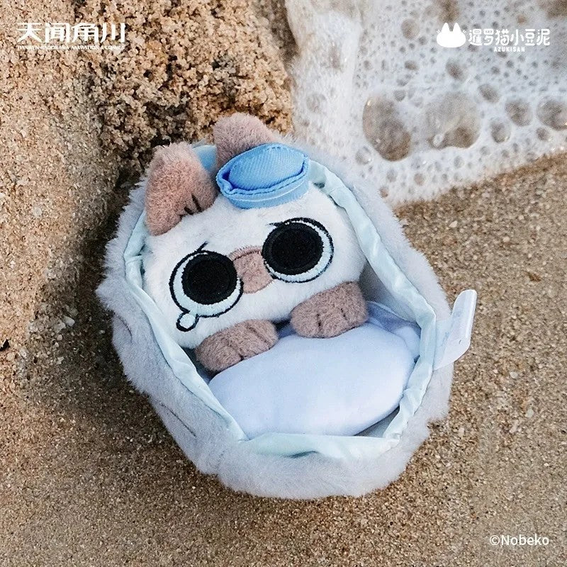 Oceanic Azukisan plush toy, cartoon cat design, in a pouch on a beach. Part of Deep Sea Adventure series, available for preorder as a blind box collectible.