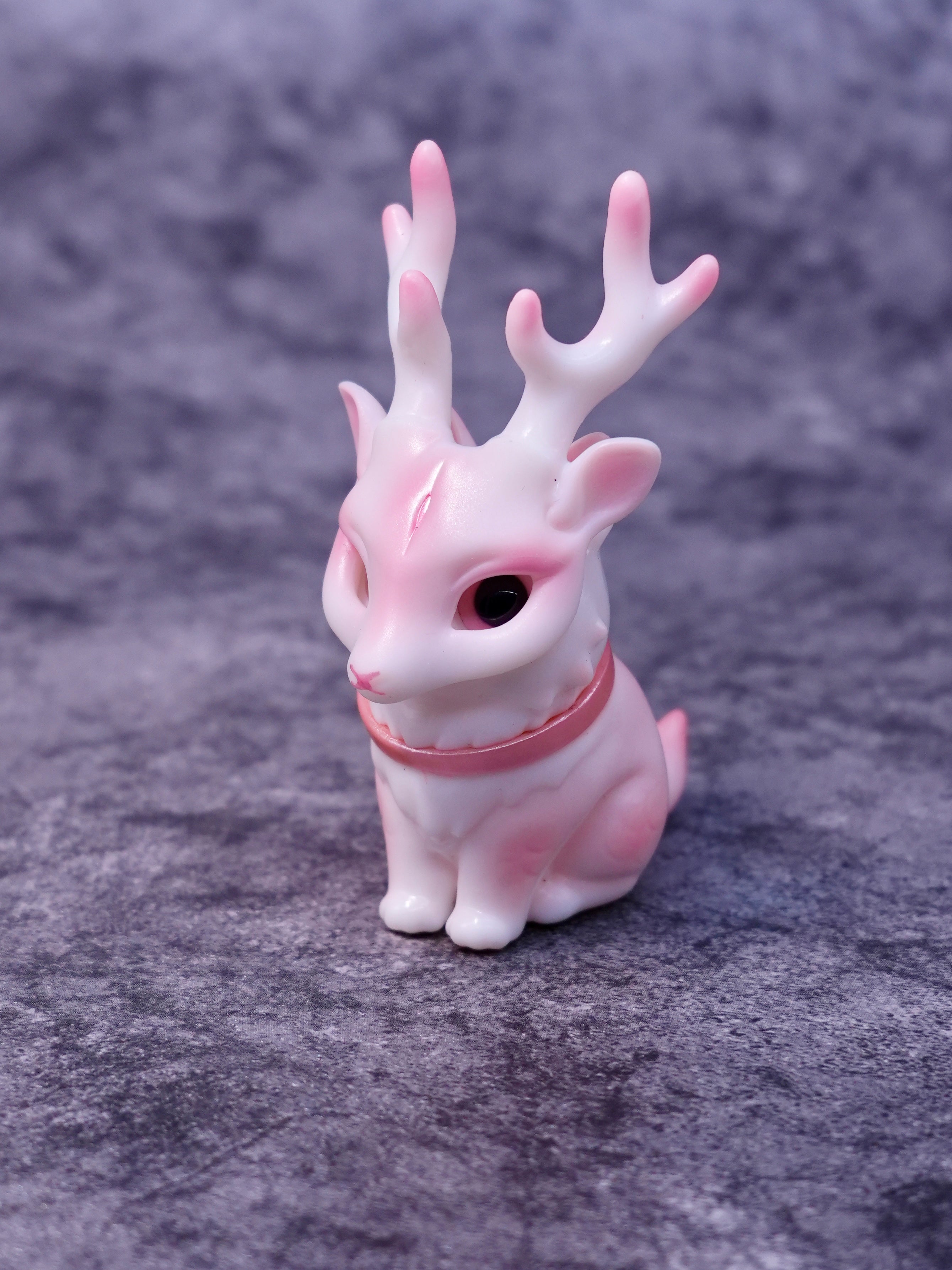 Pink Deer Cat by HOTRU, a 6.5cm figurine with coral-like antlers and rotatable head, crafted in soft vinyl and resin, available for preorder.