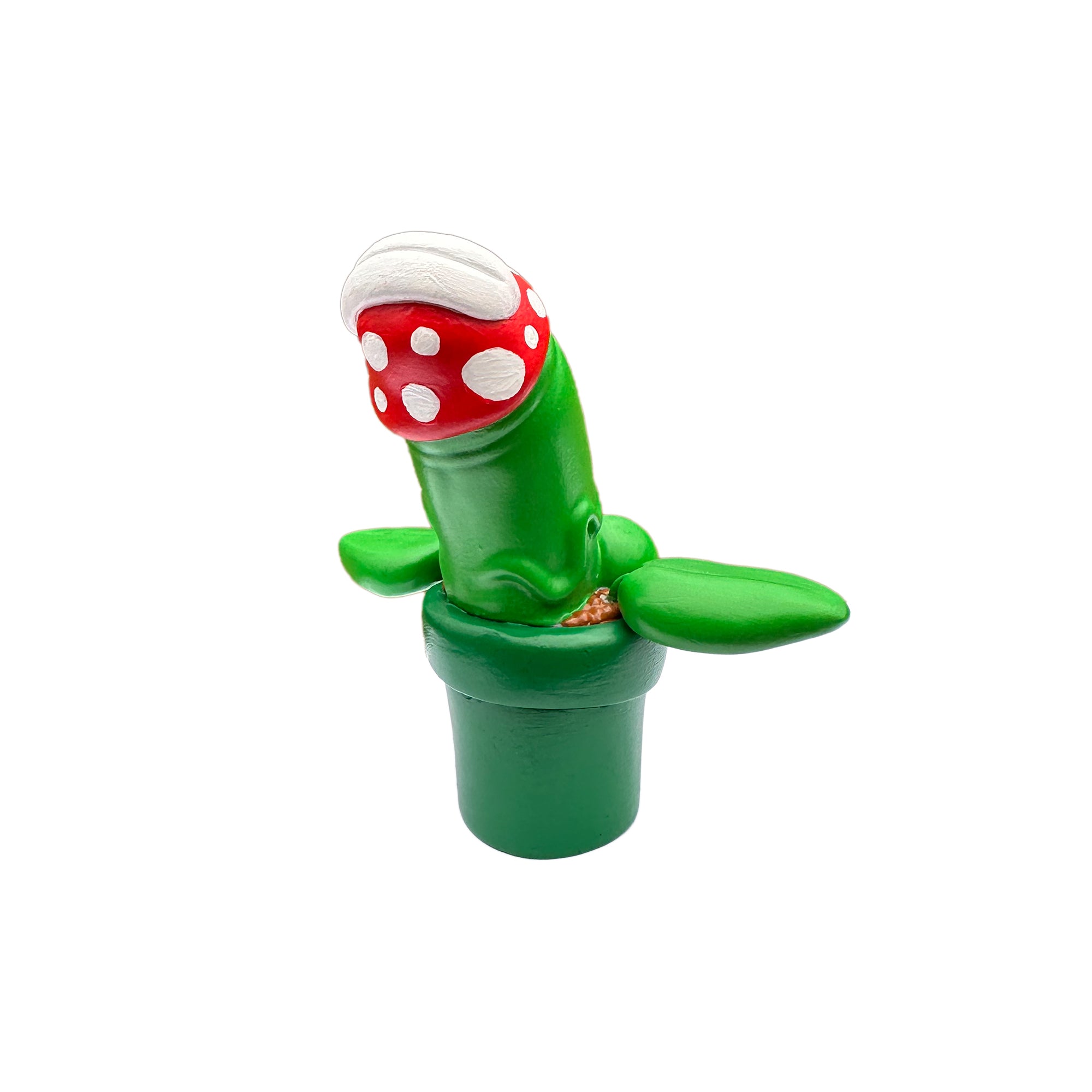 A green plant with a red hat and mushroom toy, close-up details, part of Simon Says Macy & Friends - Piranha Pecker by Prime.