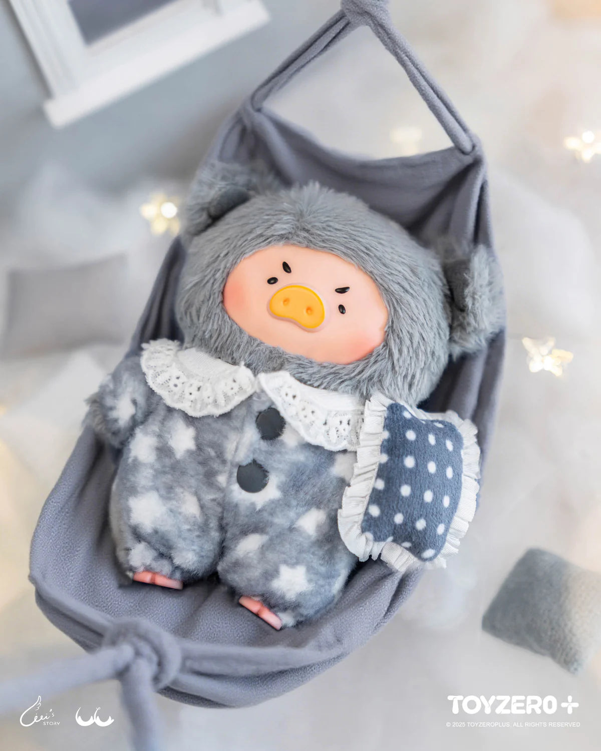 LuLu the Piggy plush in pajamas rests in a hammock, holding a cushion; part of LuLu’s Dreaming Wonderland Series PVC Plush Keychain Blindbox.