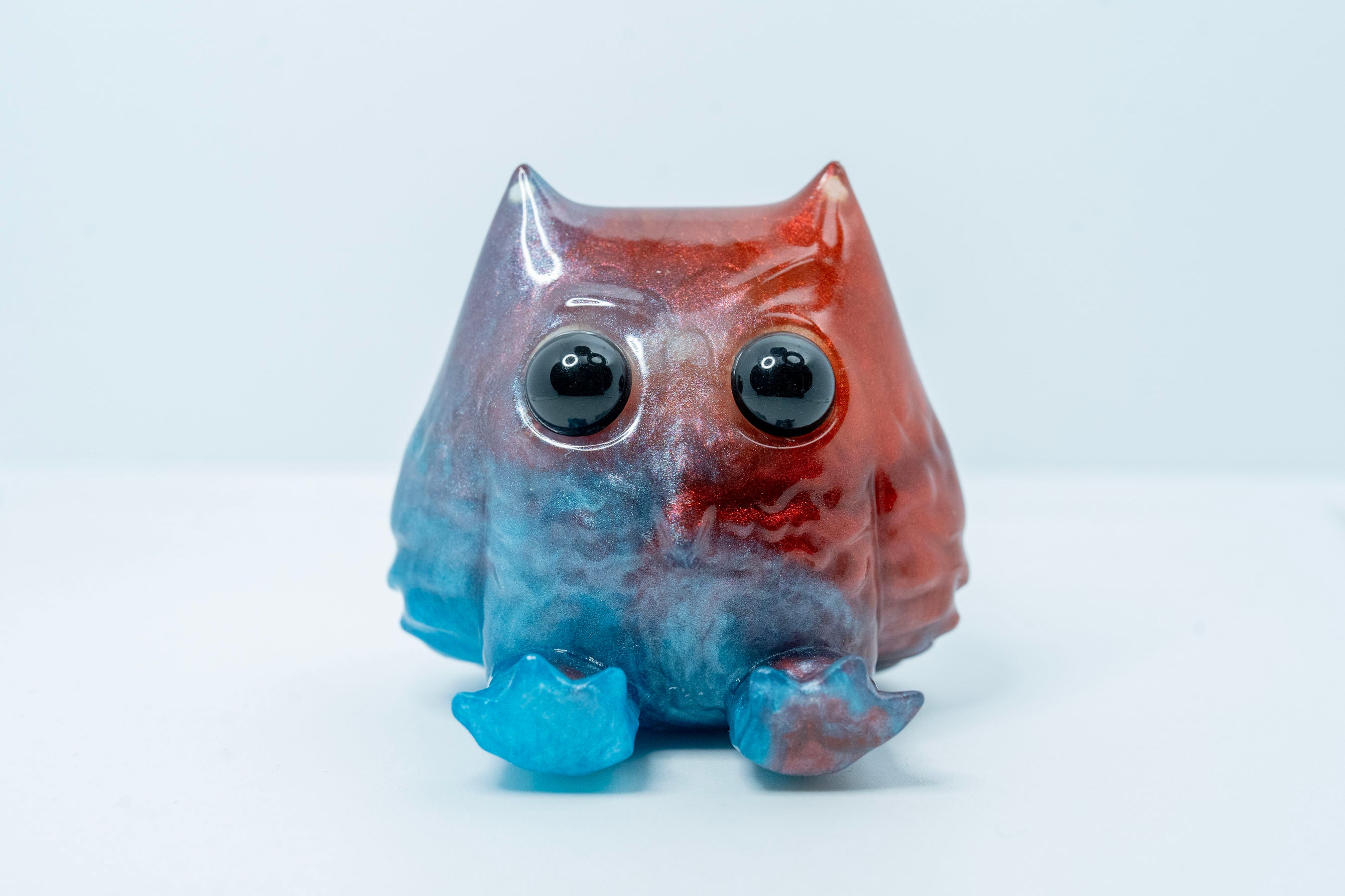 A resin toy owl, part of the Little Shit Big Deal - Sitzend Wyze collection by House of Wyze. Limited edition of 5 pieces, ships randomly. Gallery items ship 28 days after show opening.