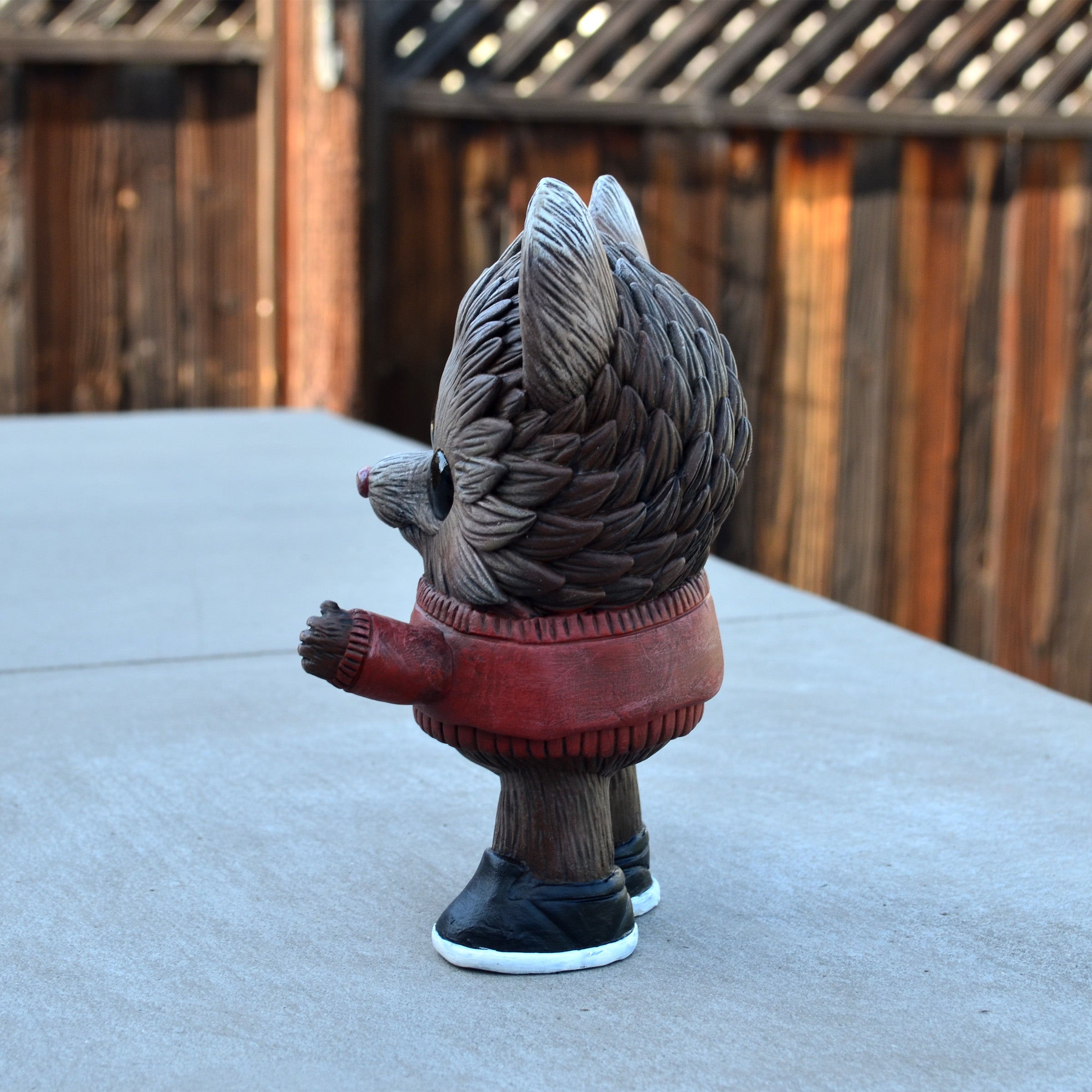 Beans Group Show - Reynard figurine by Vanessa Ramirez x Josh Divine: a 4x3x6.25-inch hedgehog sculpture in a red sweater, preordering for May 2026.