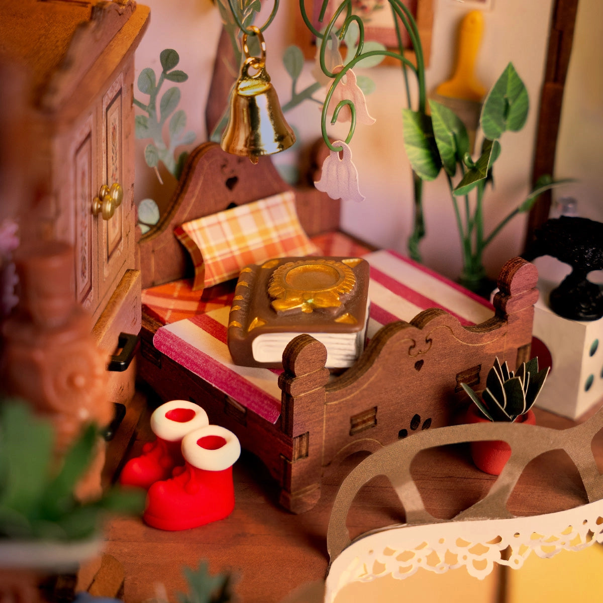 Rolife DIY Miniature House - Fairytale Tree House DG179: Detailed diorama of a cozy bedroom with wooden bed, toy boots, floral decorations, and miniature plants.