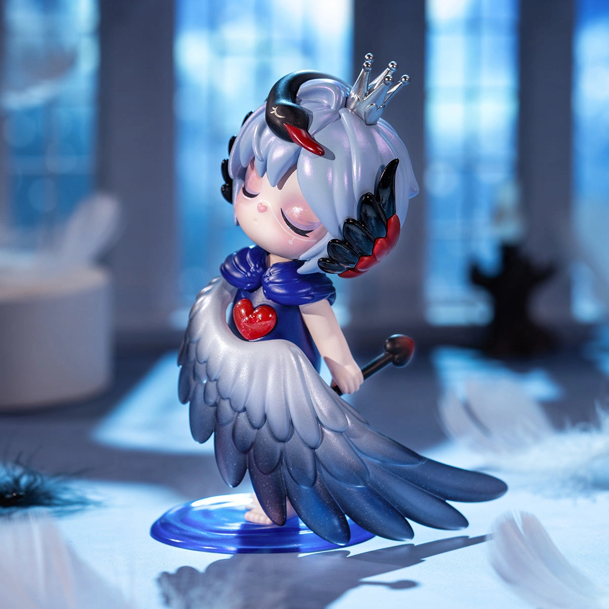Suri's Mystery Castle Blind Box Series figure with lavender hair, silver crown, swan-themed cape, glossy red heart, and scepter on a blue base.