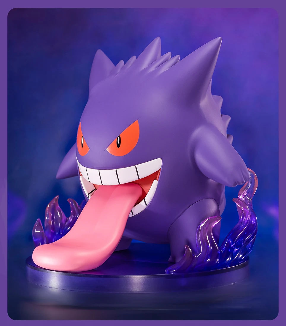 Pokémon Gengar Figurine: Cartoon monster with tongue out, orange eye, and blue sculpture.