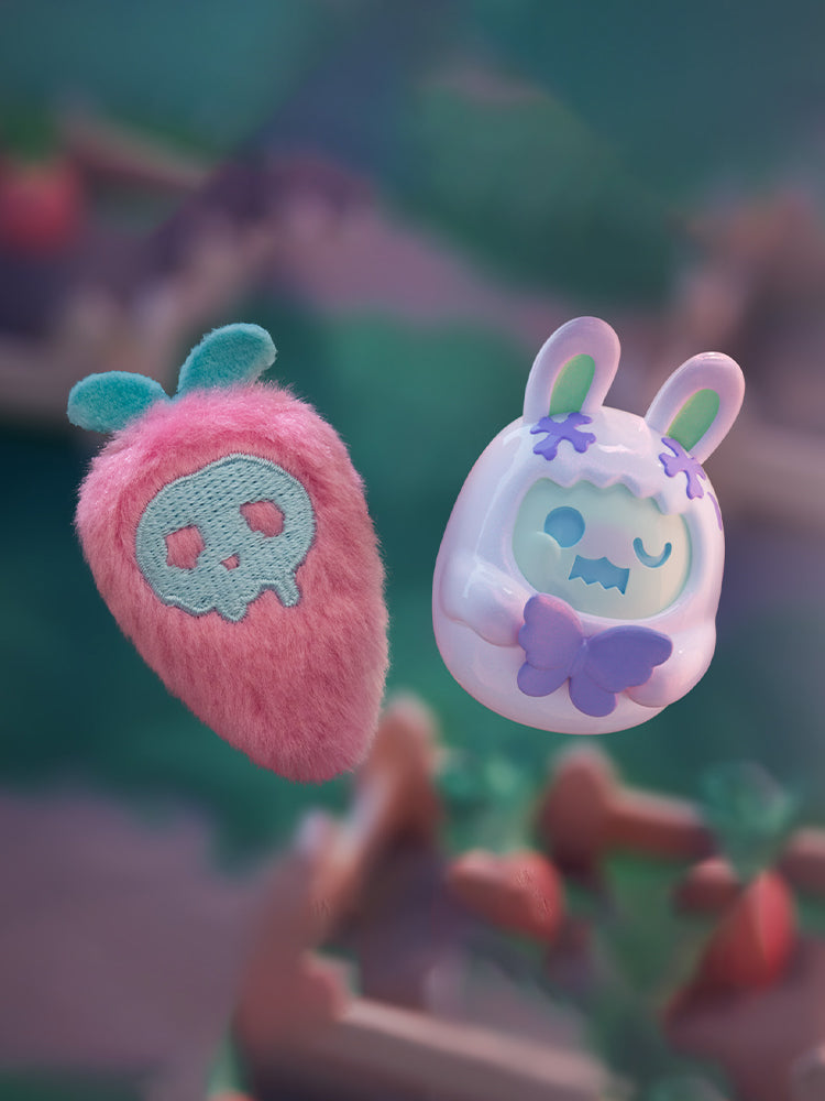 ShinWoo - Hug Me Mini Series Blind Box features a plush strawberry and a glossy ghost-bunny figurine, set in a whimsical garden-themed background.