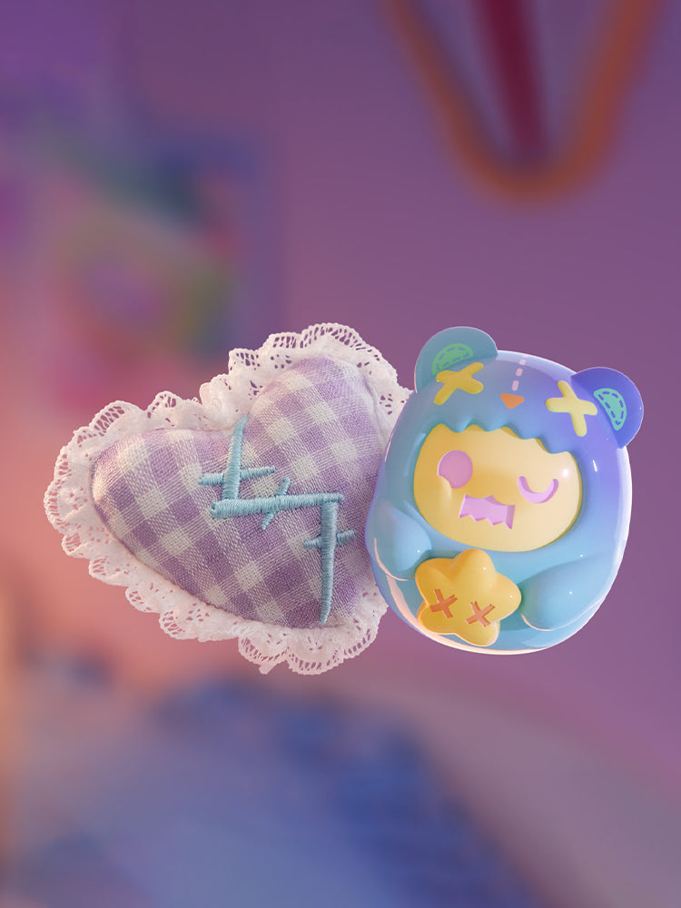 ShinWoo - Hug Me Mini Series Blind Box: A purple heart cushion with lace trim and a blue bear-like collectible figure holding a yellow star.