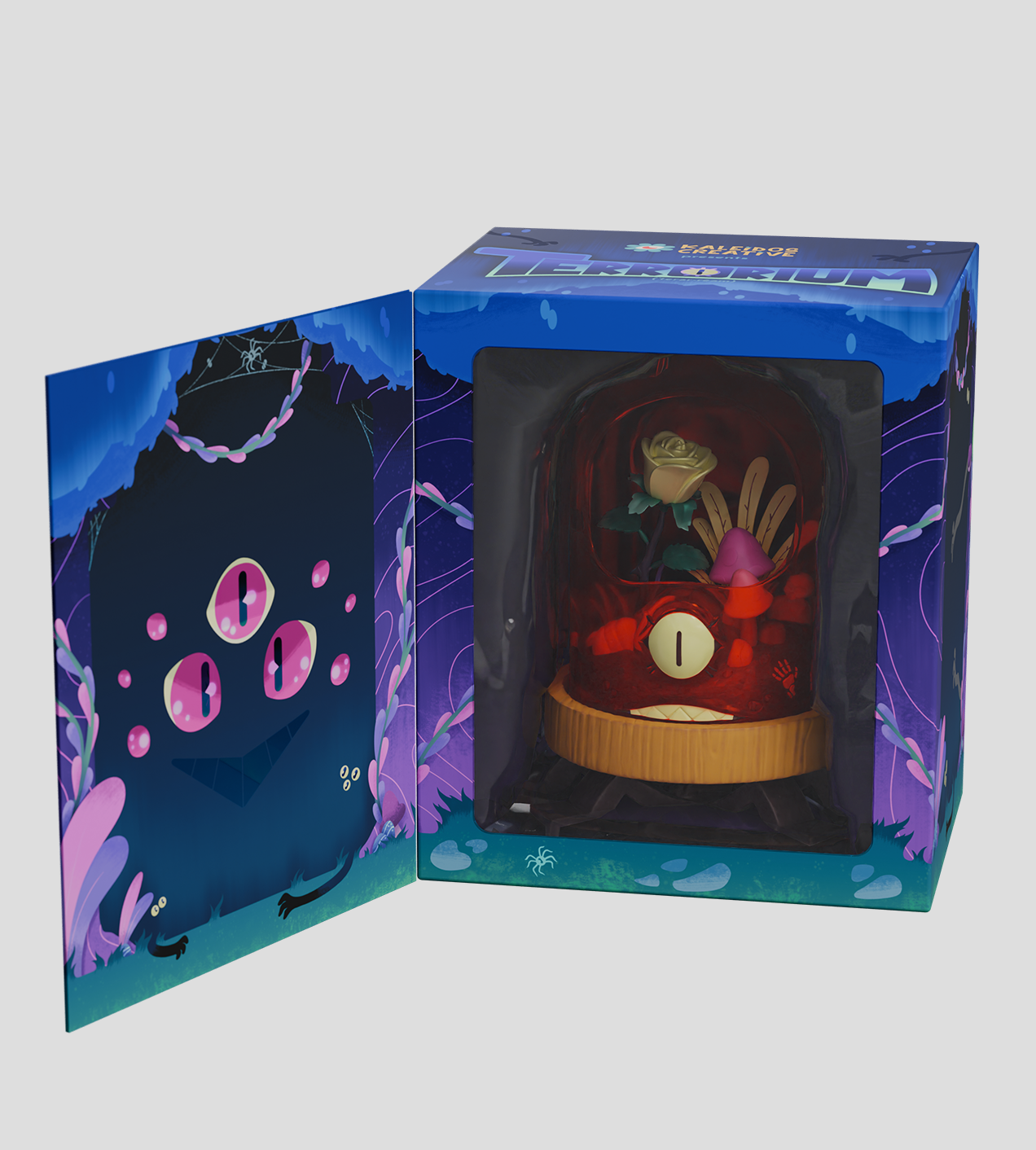 Terrarium - Crab Cloche: A decorative diorama with a glowing eye, mushrooms, and foliage under a removable dome in concept packaging with a night-forest illustration.