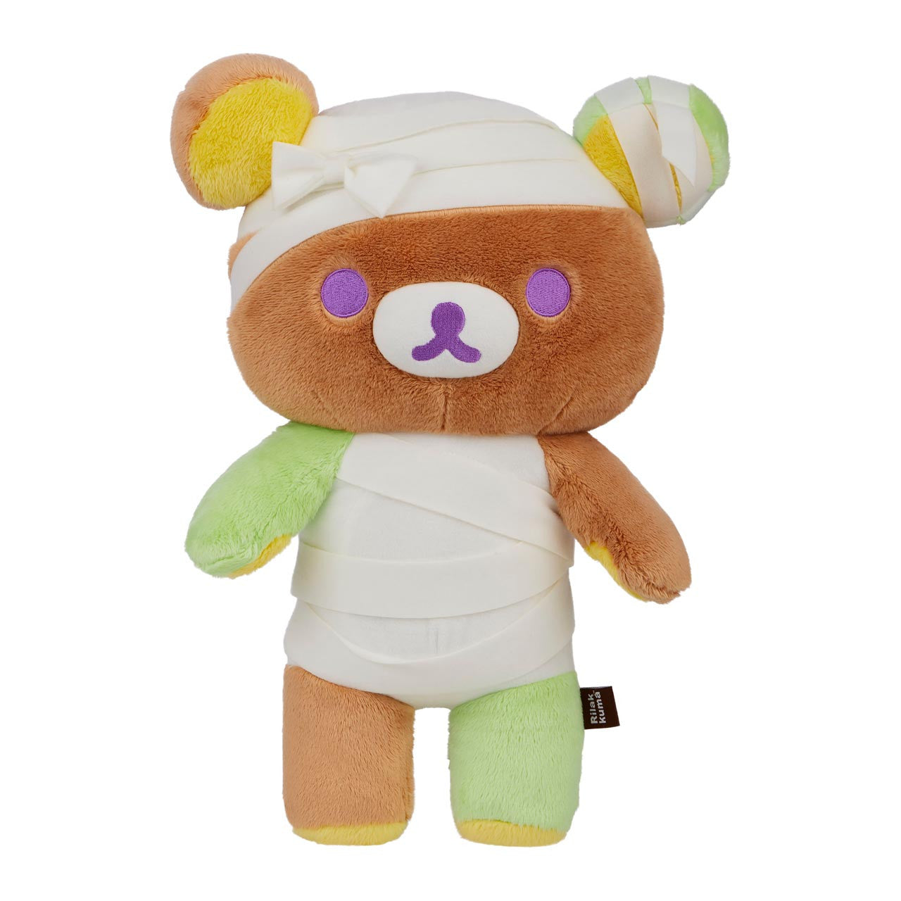 Rilakkuma San-X Original Mummy Costume Plush, a 14.5-inch teddy bear wrapped in white bandages, featuring lime green limbs and purple facial details.
