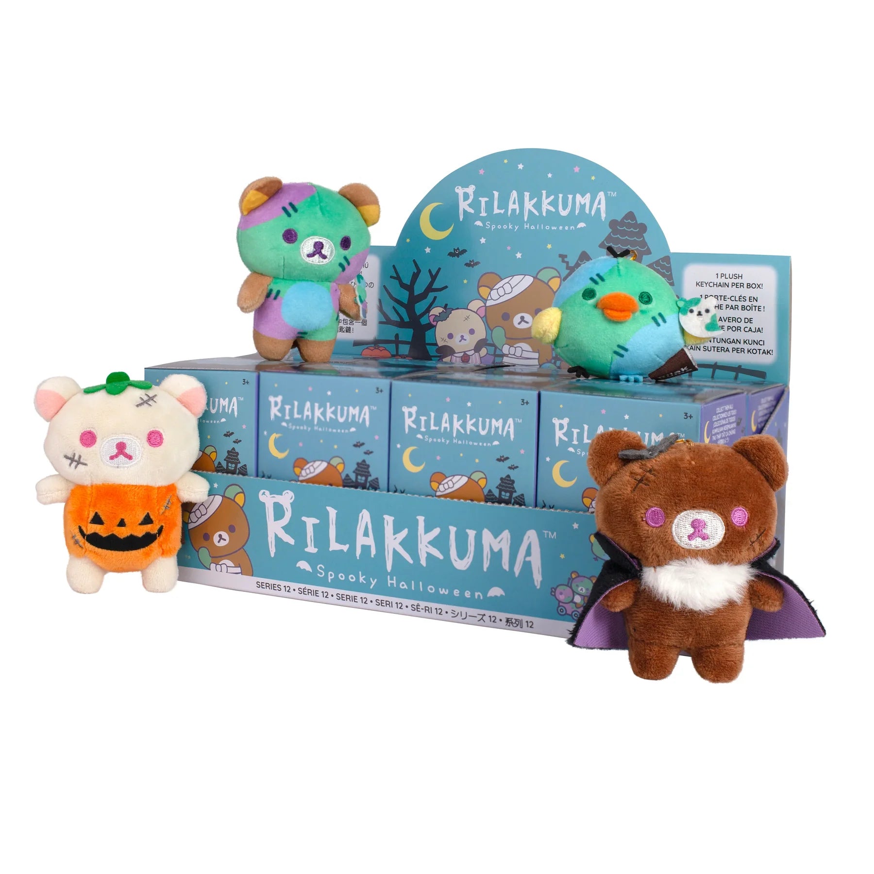 Rilakkuma Spooky Halloween Plush Keychain Blind Box Series 12 featuring Korilakkuma, Rilakkuma, and Kiiroitori in festive Halloween costumes displayed on a themed countertop box.