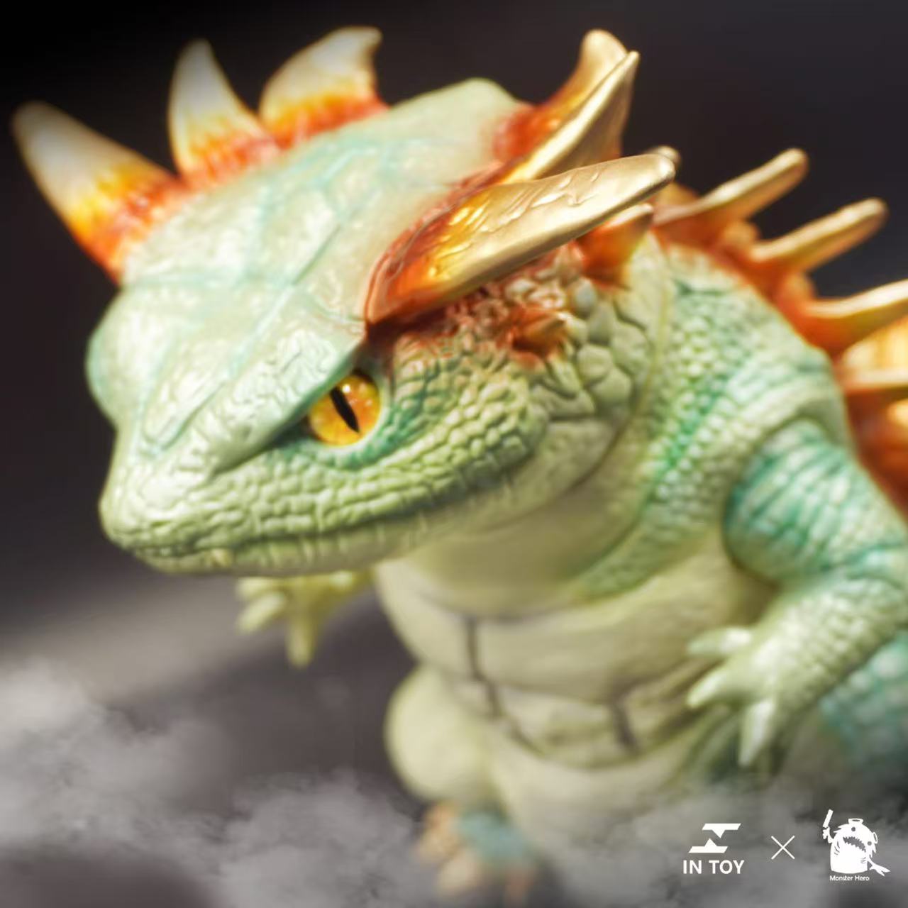 Salamander Super Beast - Jasper .Ver, a collectible vinyl toy, features a green dragon-like design with golden spines, part of the IN TOY × Monster Hero collaboration.