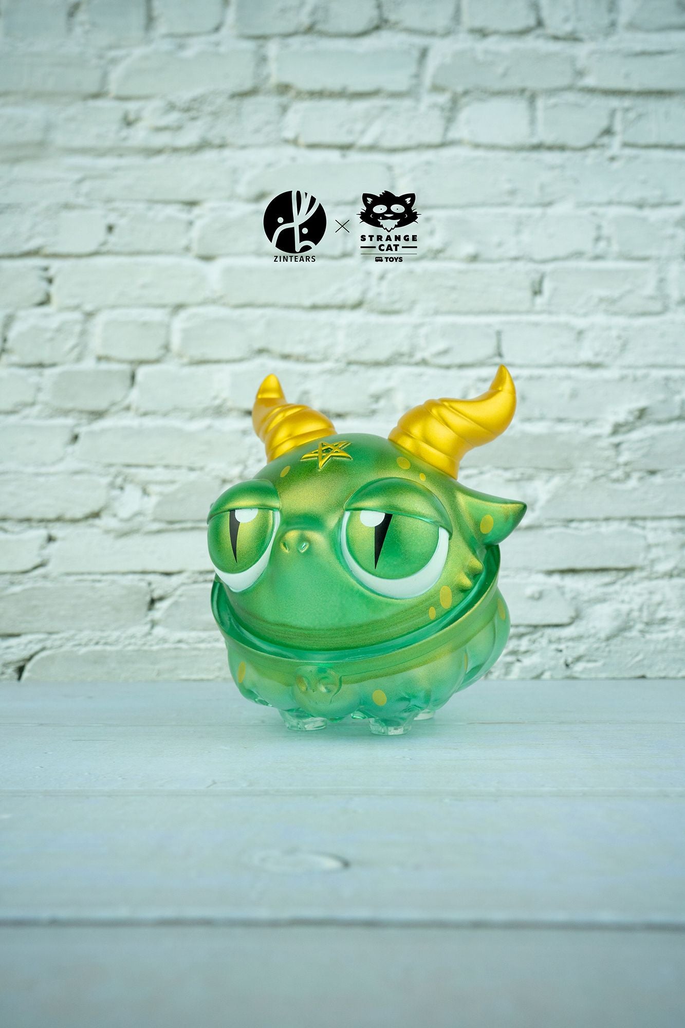 A 10cm tall vinyl toy featuring Bobbi The Baphomet - Dragon by Zintears, with a cartoon frog design and limited to 100pcs.