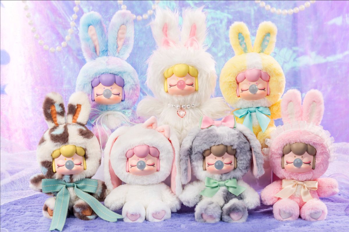 Nanci's Shining Bunny Plush Blind Box featuring a close-up of a smiling cartoon doll face, showcasing one of the seven collectible designs.