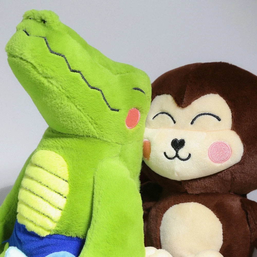 Monkay + Alligator Plush by Life Machine features a green crocodile and brown monkey, each with magnetic accessories, promoting harmony and balance.