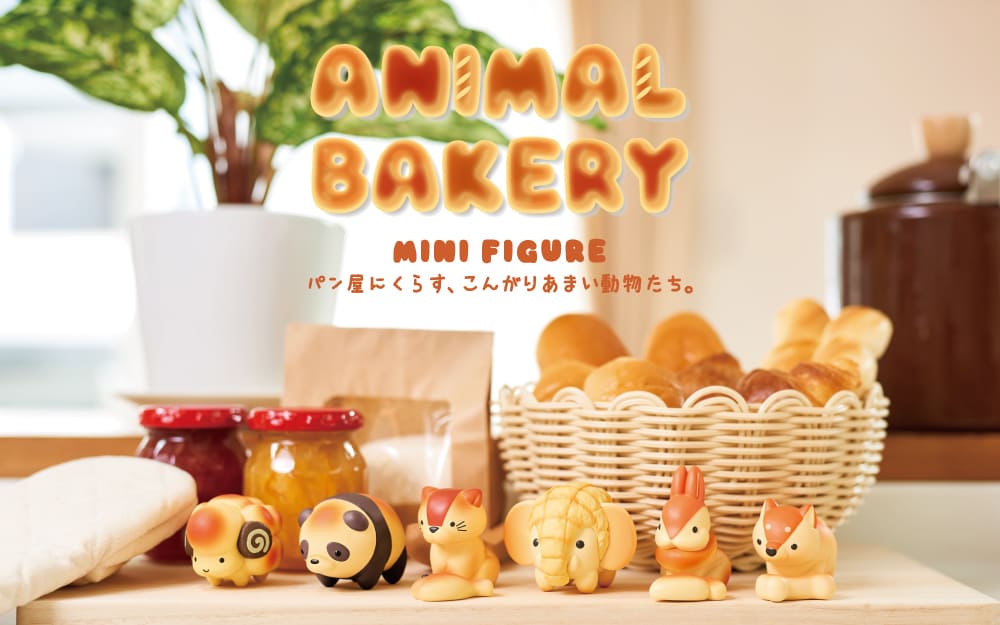 Animal Bakery Mini Blind Box Series showcasing various small figurines on a table, including a toy panda and stuffed elephant, part of a mystery collection.