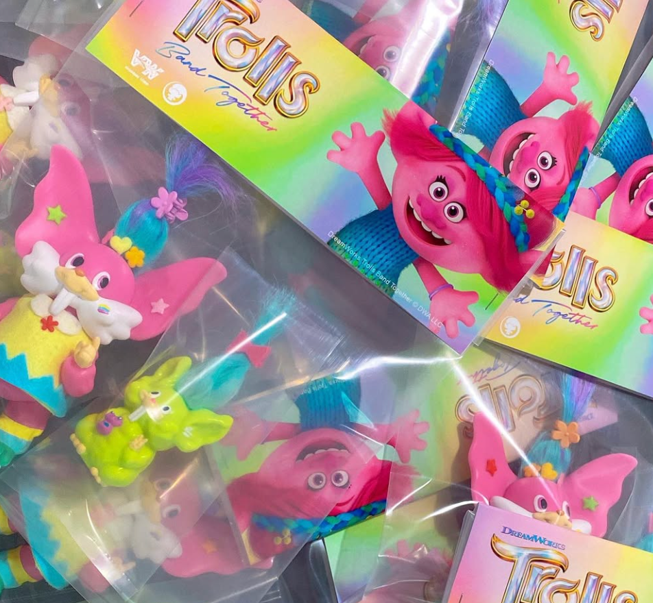 Trolls Trolls by Vivian Wang: Sealed DreamWorks “Trolls: Band Together” collectible figures, featuring vibrant Trolls characters like pink-haired Poppy, in clear pouches.