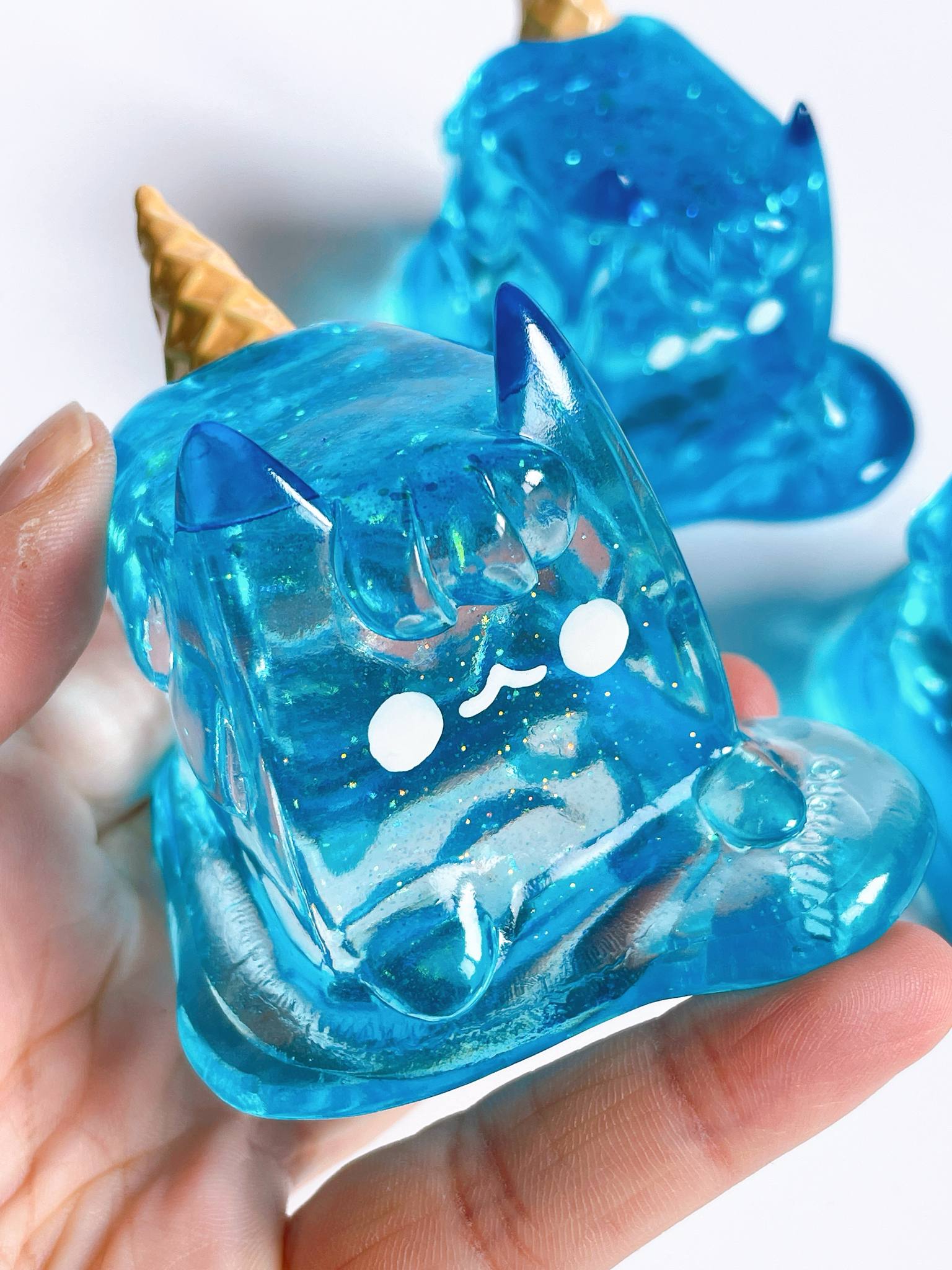 Sea salt ice cream cat by Rato Kim, a 6.5x7.2x5.8cm clear resin sofuvi, available for preorder, shipping June 2025.