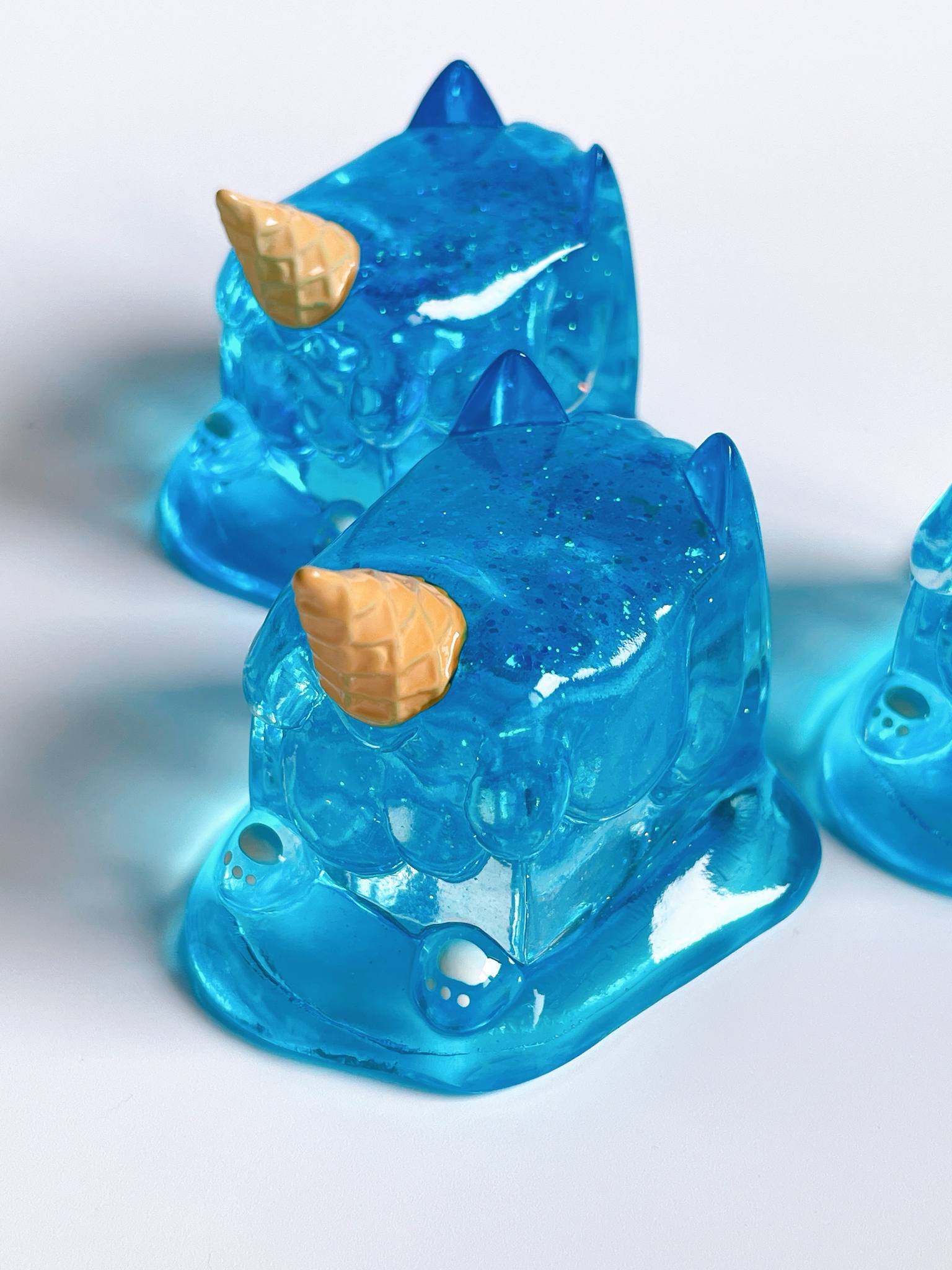 Sea salt ice cream cat by Rato Kim, a 6.5x7.2x5.8cm clear resin sofubi toy, available for preorder, ships June 2025.