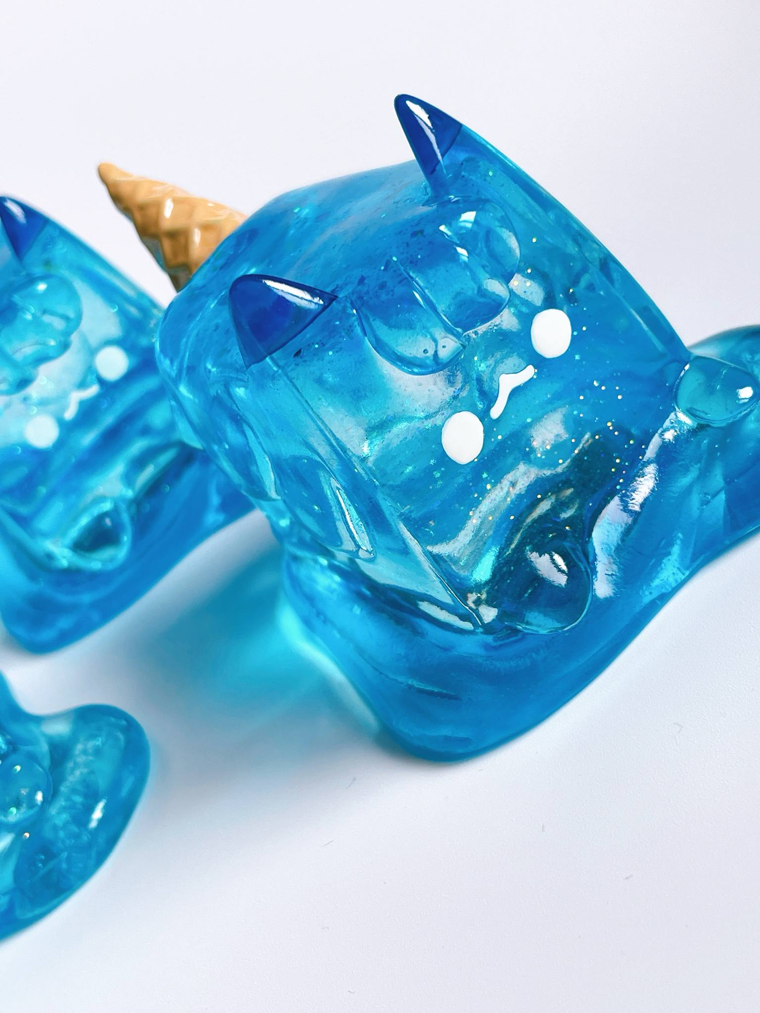Sea salt ice cream cat by Rato Kim, a clear resin sofubi art toy. Available for preorder, ships June 2025. Dimensions: 6.5x7.2x5.8cm.