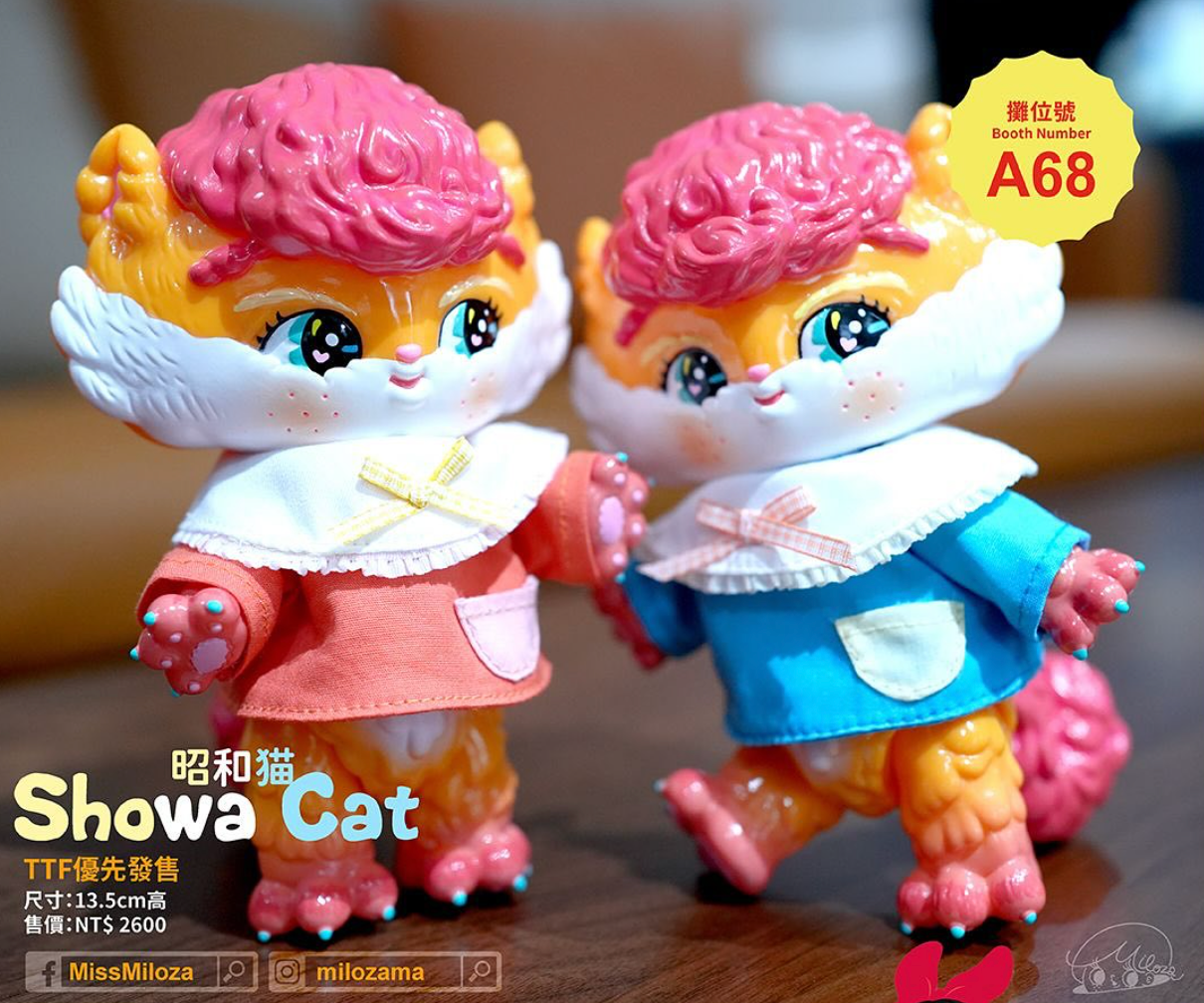 Showa Cats by MissMiloza, 13.5 cm vinyl figures with sparkling eyes, curly pink hair, and ruffled collars, preview-sold at TTF for NT$2,600 each.