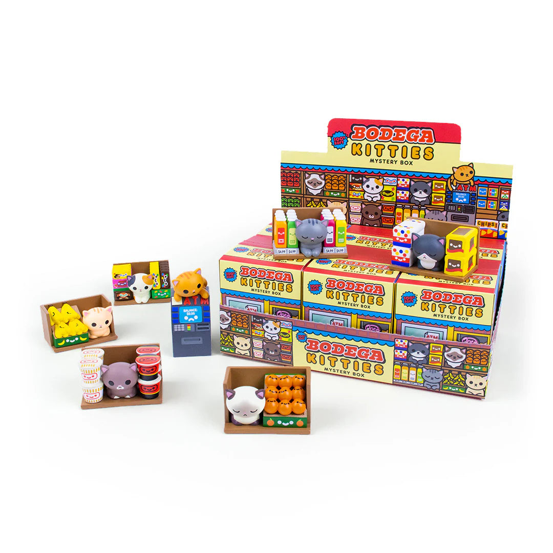 Bodega Kitties Mystery Boxes by 100% Soft, featuring various toy figures in blind box packaging, offering a surprise collectible experience.