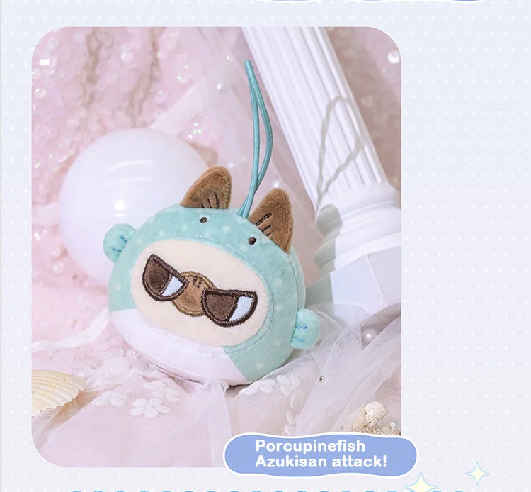 Oceanic Azukisan-Deep Sea Adventure plush, a mint-green porcupinefish toy with grumpy face, available for preorder, photographed against pink backdrop.