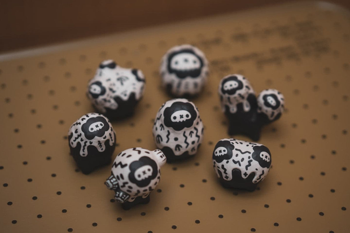 Copiapoa Mudball Blind Box Series by Robin Huang, featuring a close-up of a panda toy, part of a dice-themed tabletop game collection.