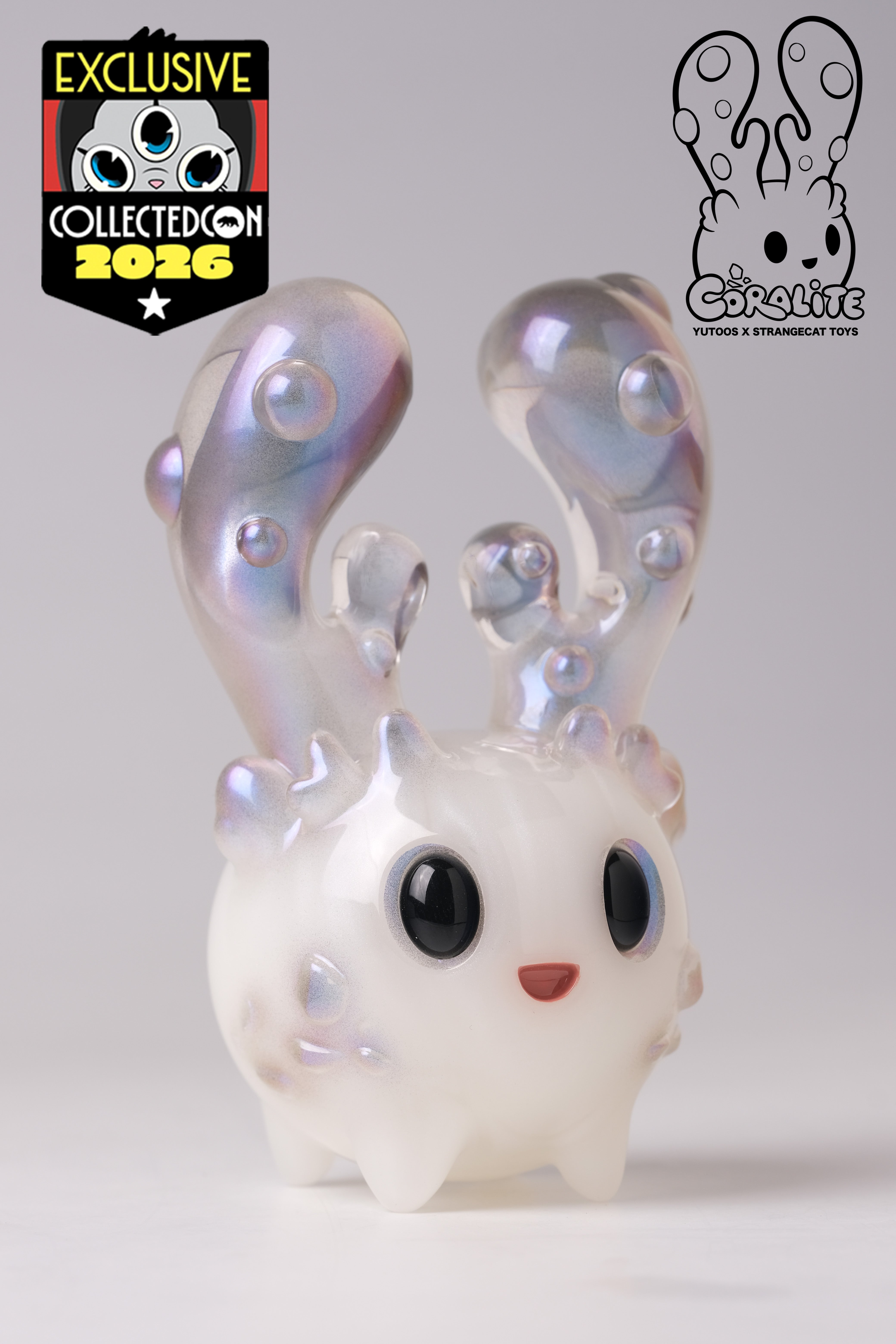 Coralite by Yutoos: A 4-inch, iridescent designer toy with antler-like horns, exclusive to CollectedCon 2026, limited to 50 pieces by Strangecat Toys.