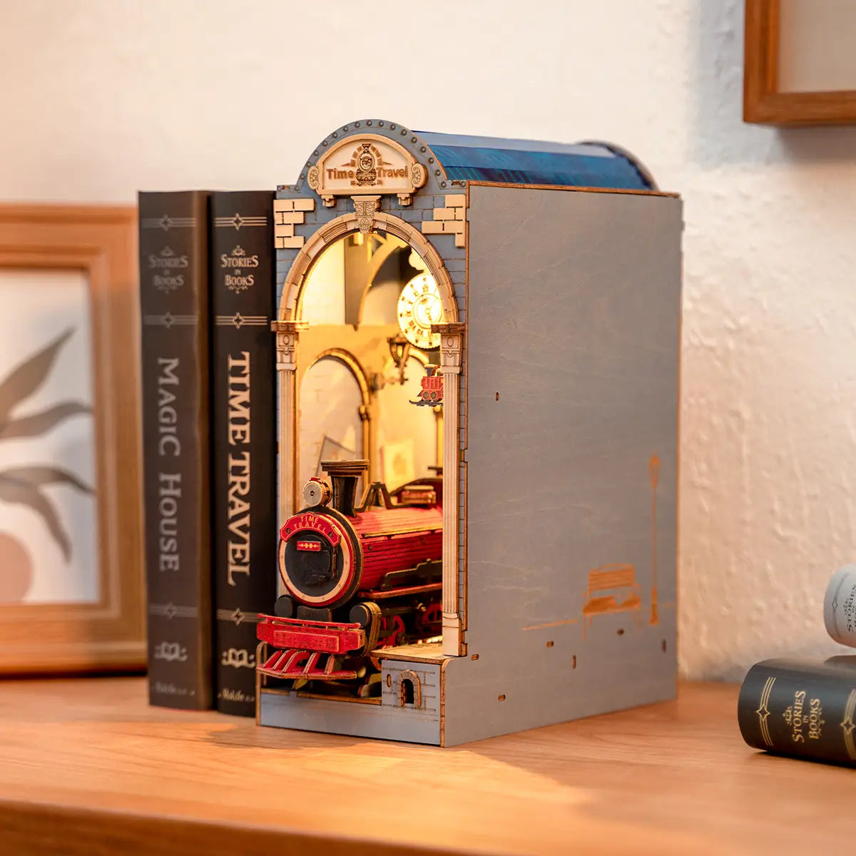 Book Nook Kits For Adults - Time Travel, featuring a model train set in a bookcase, designed for assembly and customization with included instructions and materials.