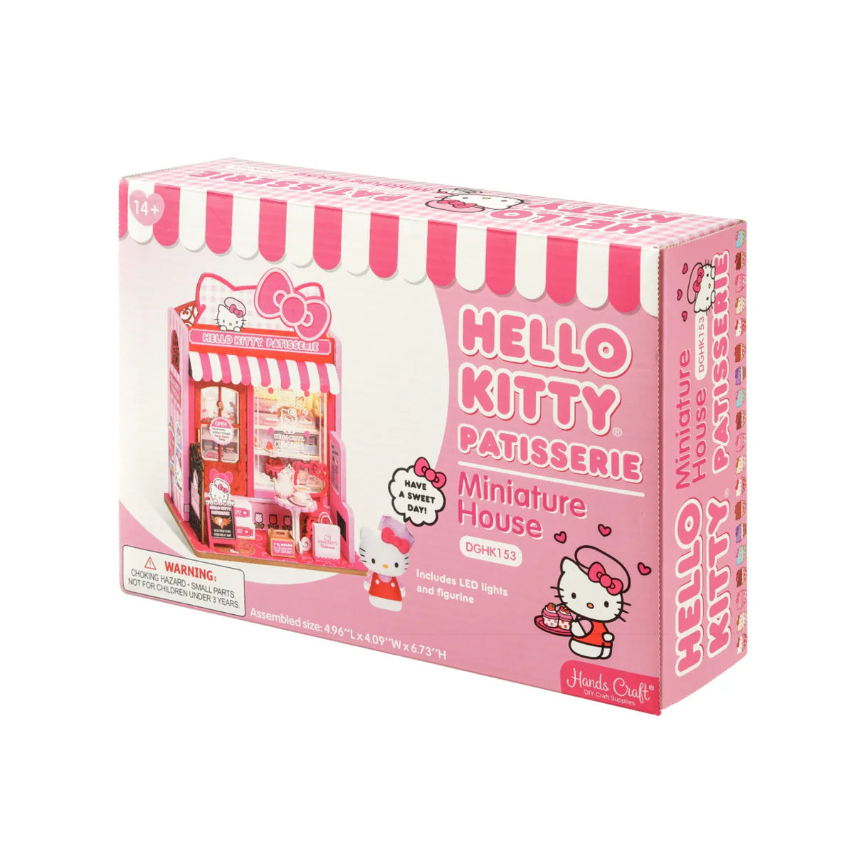 Hello Kitty Patisserie kit in pink box, featuring mini bakery scene with LED lights, Hello Kitty figurine, and choking hazard warning. Ideal for collectors and DIY enthusiasts.