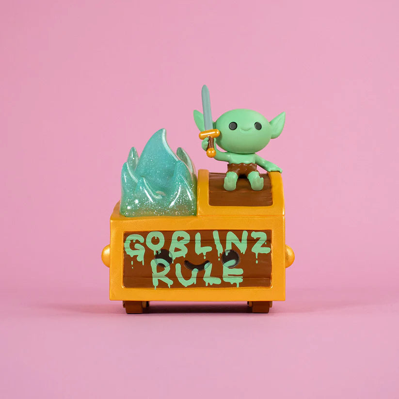 Wizard of Barge Dumpster Fire Vinyl Figure - Preorder: A goblin figure with sword on a treasure chest, featuring GOBLINZ RULE and a teal flame detail.