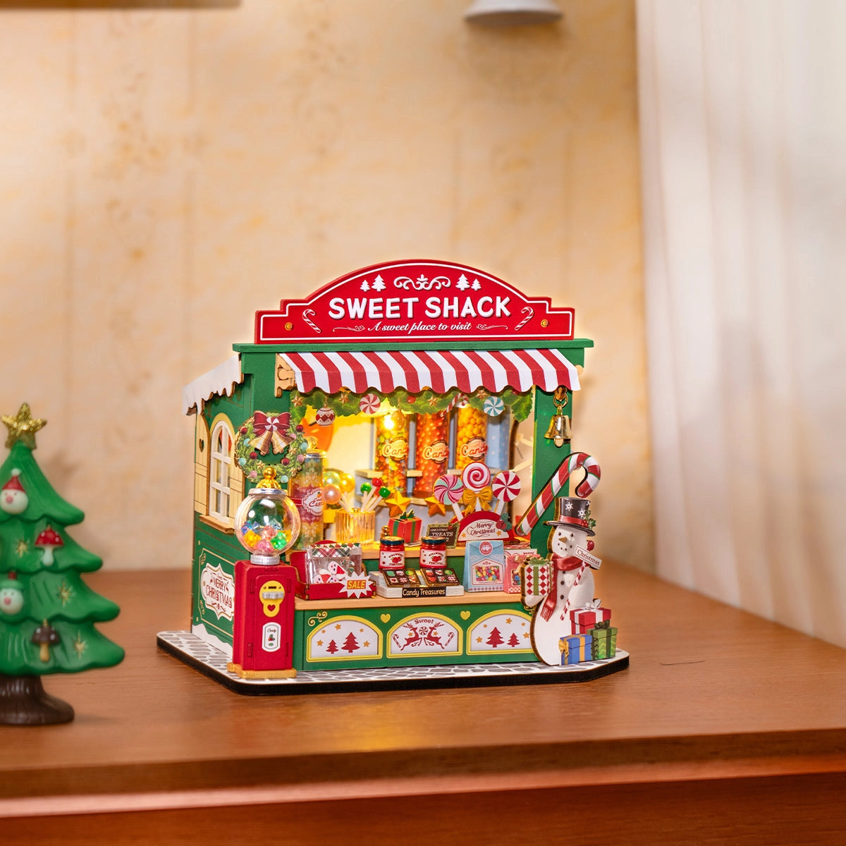 Rolife DIY Miniature House - Christmas Candy Stand DS043: A handcrafted Christmas candy shop vignette with festive decor, candy displays, and a snowman, perfect for holiday decoration.