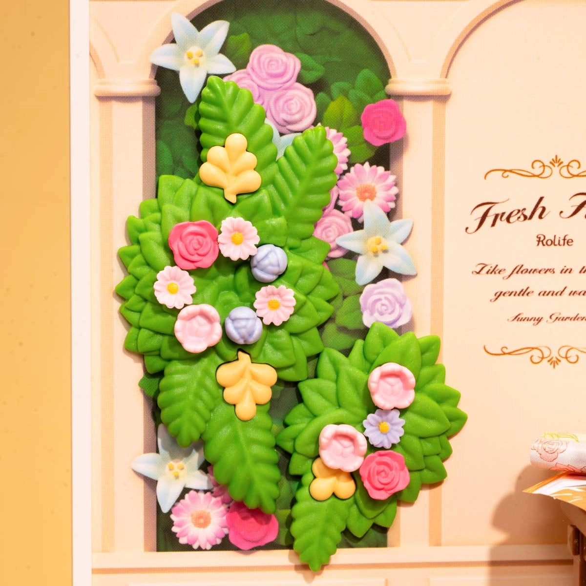 DW017B Fresh Flower Shop Rolife DIY Miniature House features sculpted green leaves and pastel flowers, perfect for enhancing any playhouse or art toy collection.
