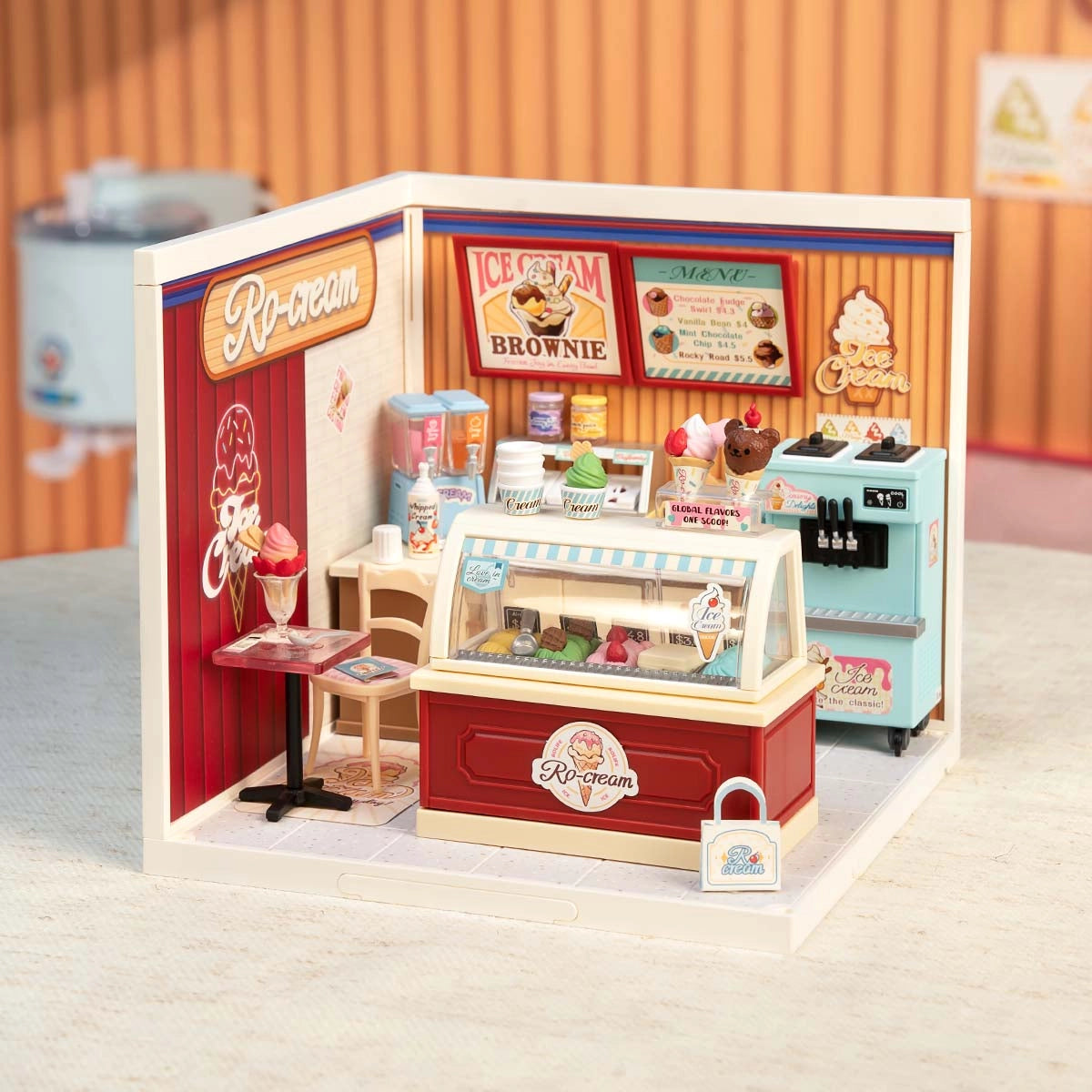 DW018B Flavorful Ice Cream Rolife Diy Miniature House features a tiny ice-cream shop with a display case, soft-serve machine, and detailed accessories.