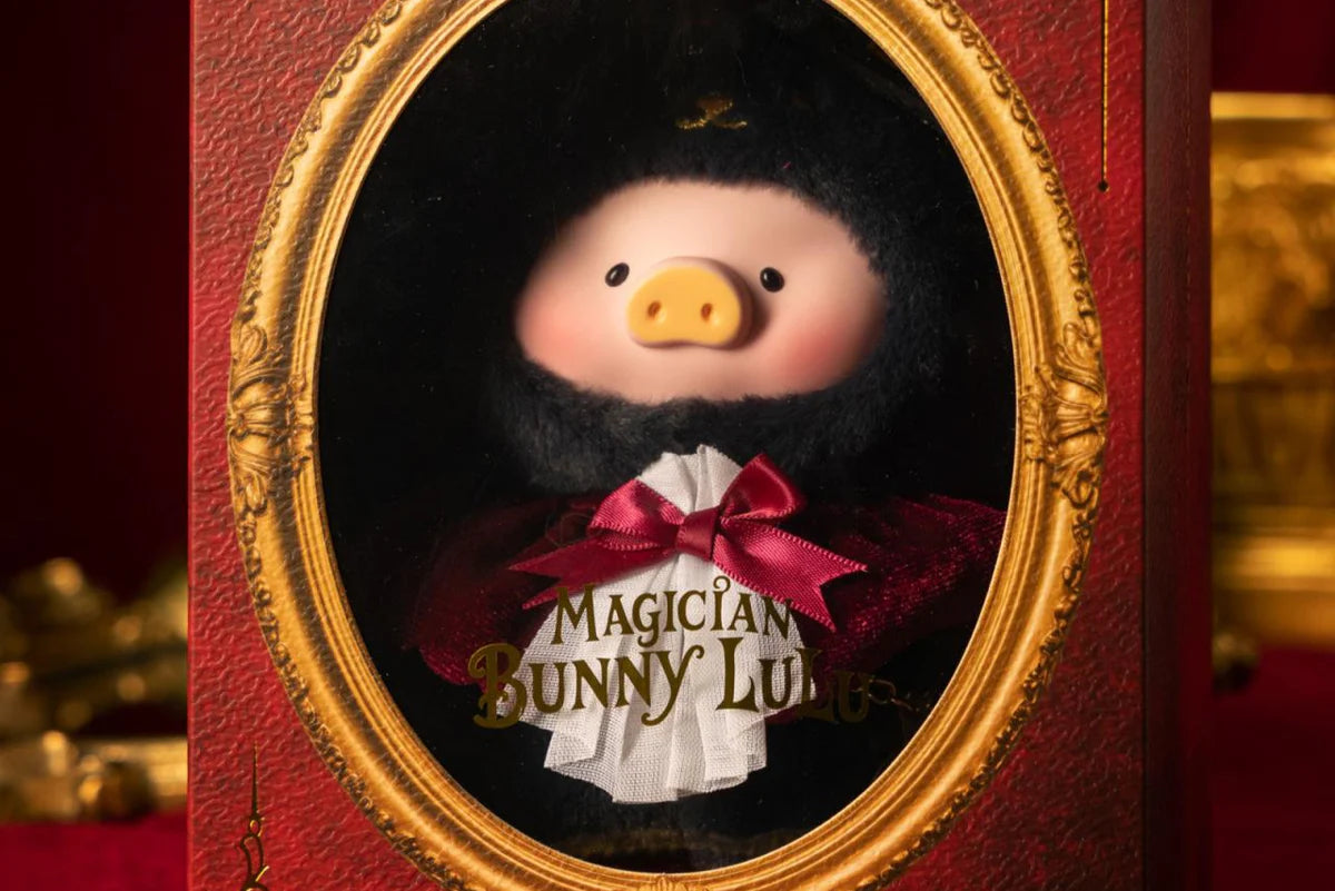 LuLu the Piggy - Vinyl Face Plush Keychain (Magician Bunny LuLu ver.) displayed in a red book-style case with a gold-trimmed window, featuring a plush in magician attire.