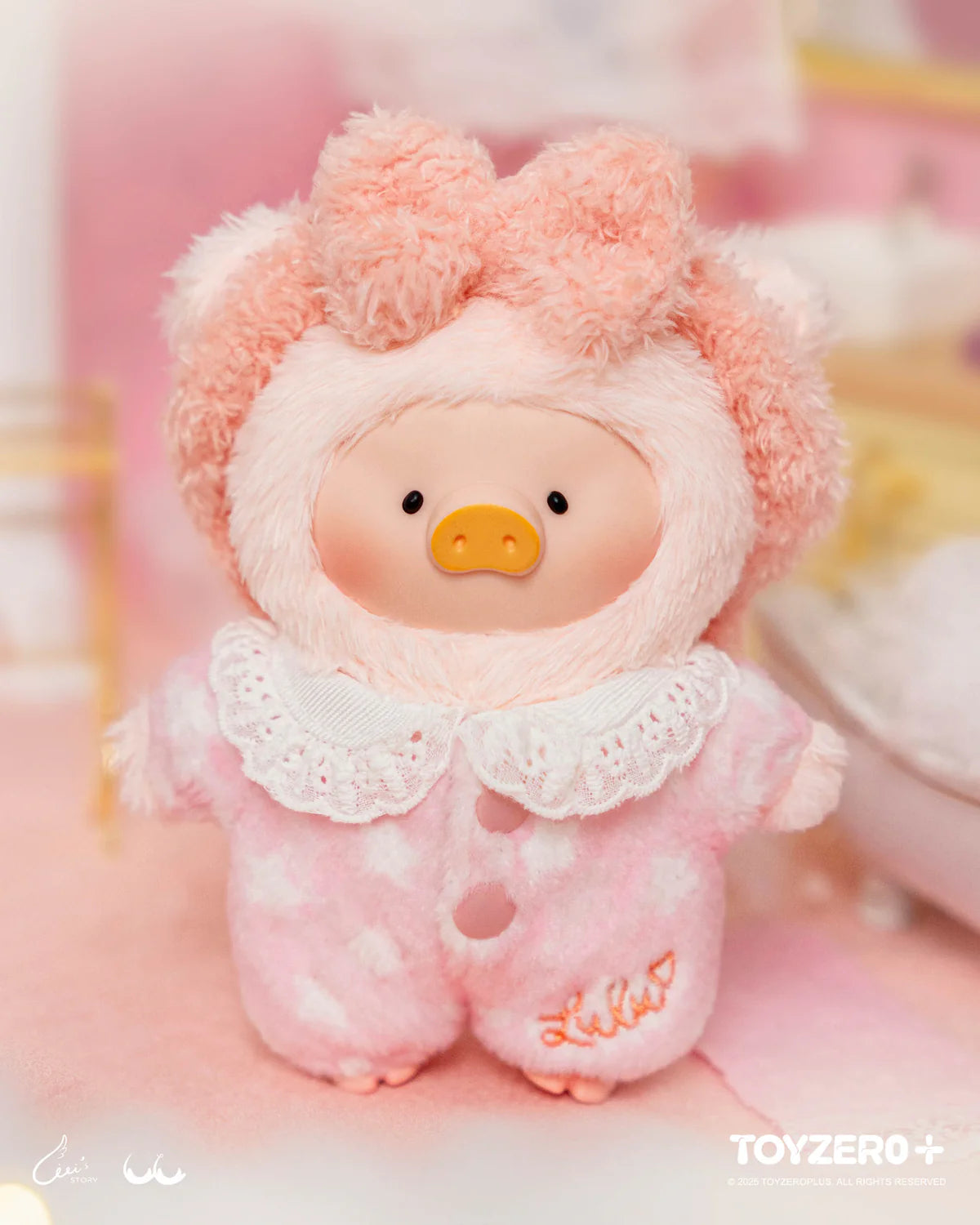 LuLu the Piggy collectible in a pink onesie, part of LuLu's Dreaming Wonderland Series, featuring keychain plush in a limited-edition blind box by TOYZERO⁺.