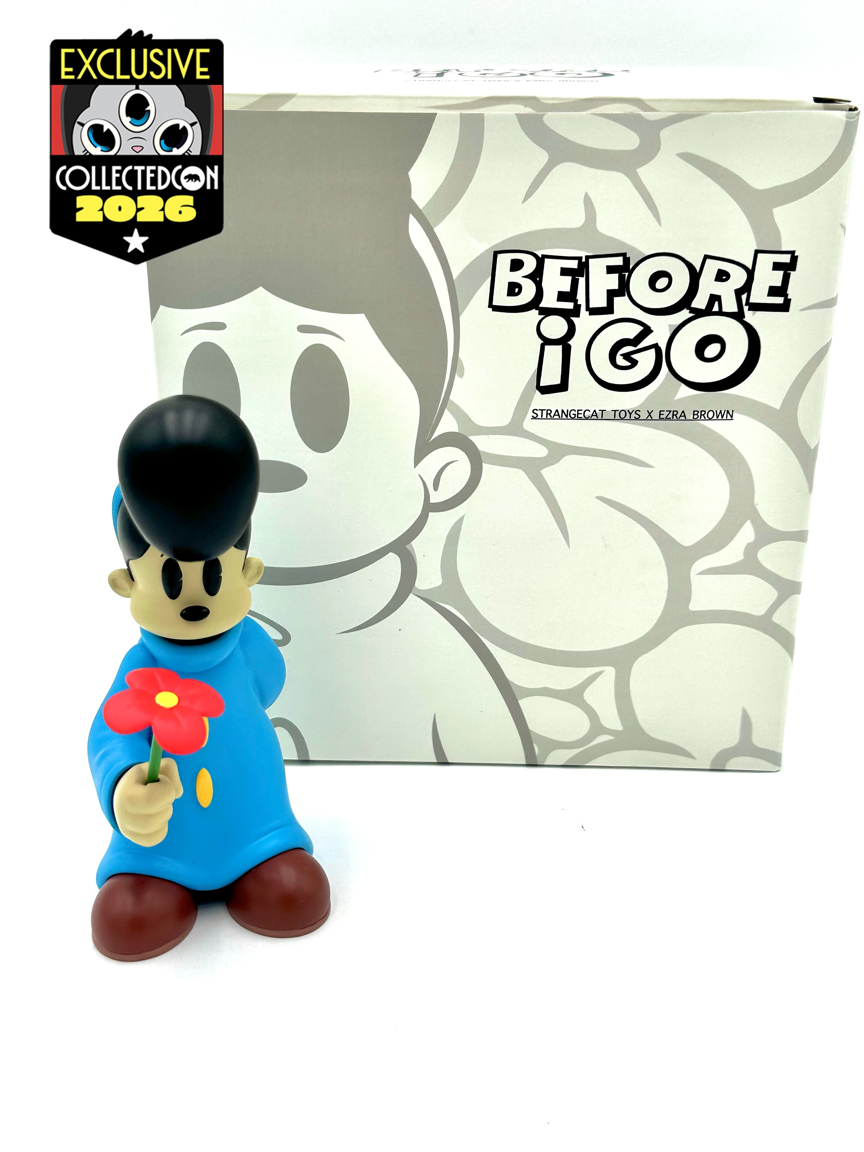 Before I Go vinyl art figure by Ezra Brown, featuring a pompadour cartoon character in a blue coat holding a red flower, 6-inch resin.