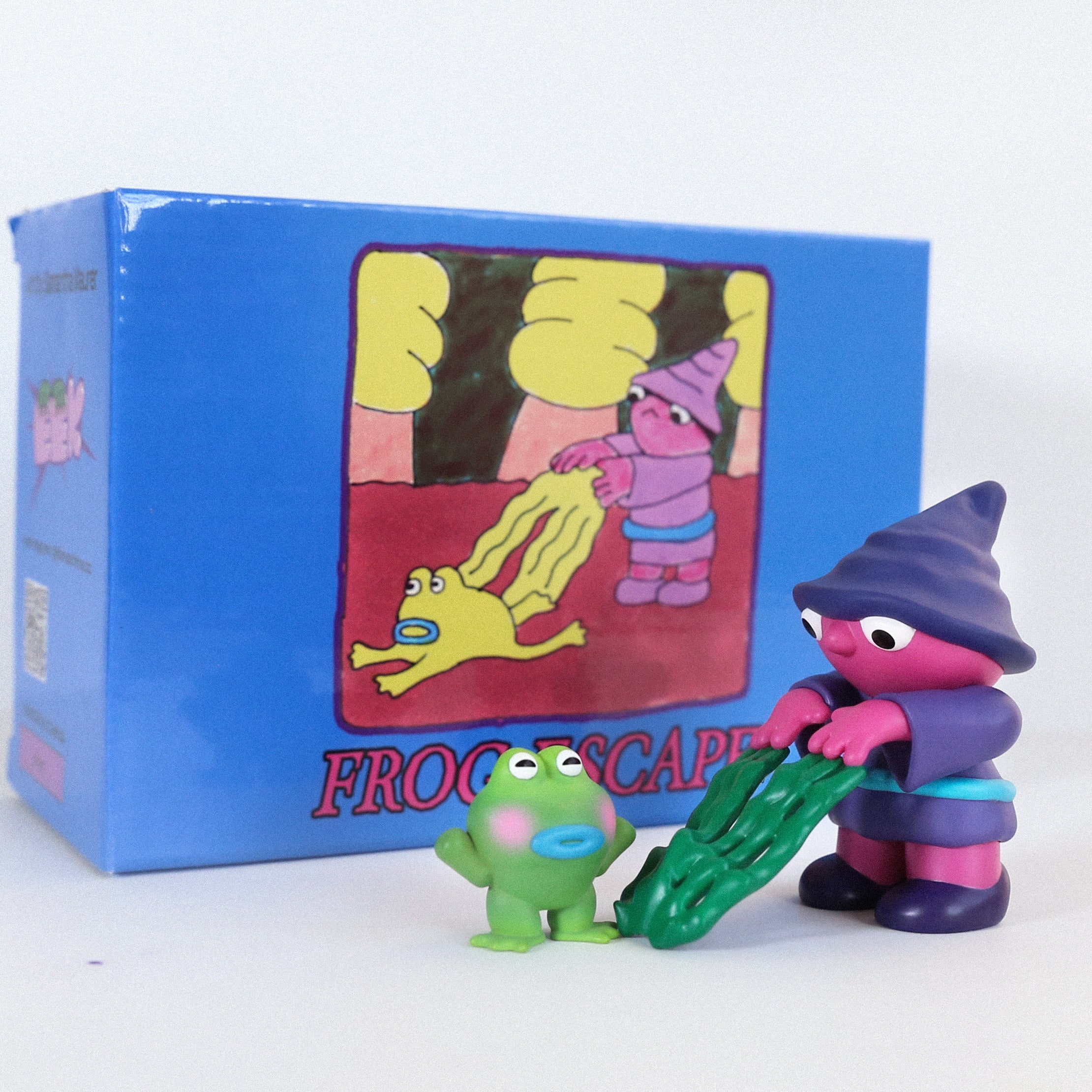 Toy figures including a frog, person with plant, and cartoon characters, part of Frog Escape by Life Machine - Preorder.
