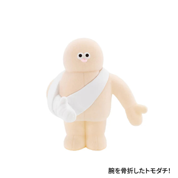 The TOMODACHI! Figure Collection Vol. 2 Gacha features a plush toy with a sling, embodying a charming friend with a broken arm theme.