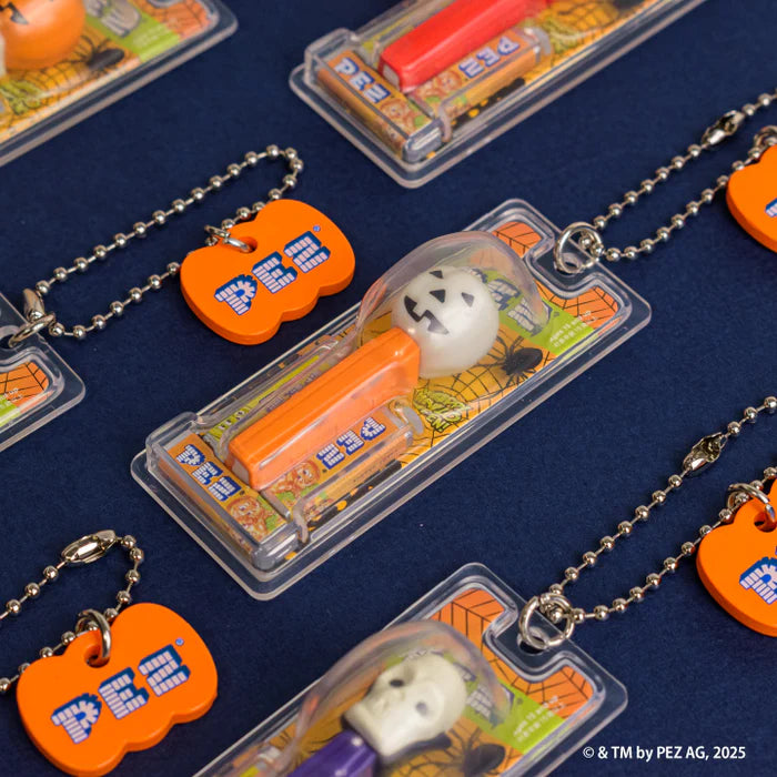 PEZ Ball Chain Mascot Halloween Ver. Gacha Series features jack-o’-lantern and skull dispensers with matching keychain tags in blister packs.