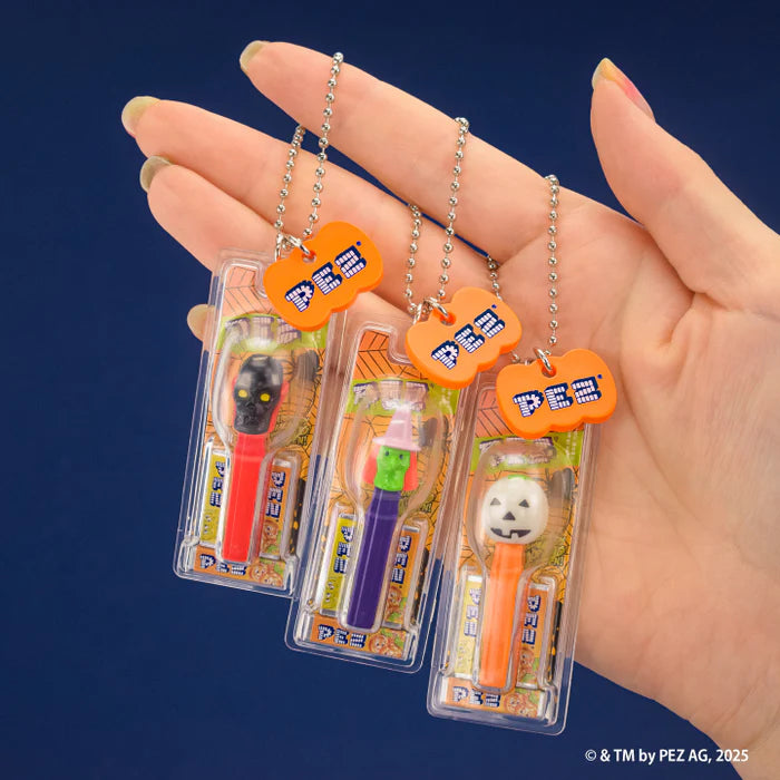 PEZ Ball Chain Mascot Halloween Ver. Gacha Series: Three Halloween-themed dispensers, each with a key-tag, held in hand, showcasing random collectible toy options.
