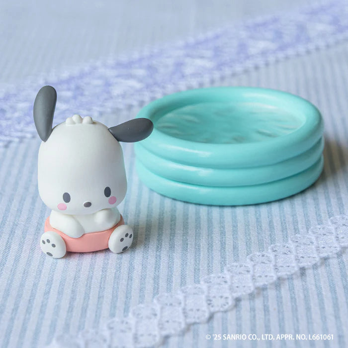 Sanrio Characters Baby Room Collection 2nd Edition Gacha Series figurine featuring Pochacco in a pink swim ring beside a tiny turquoise pool prop.