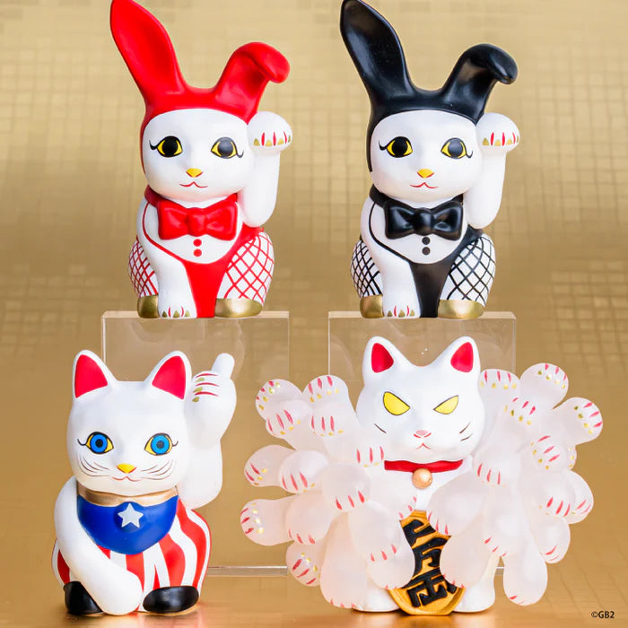 Contemporary Art: Private Maneki-neko Gacha Series featuring four unique beckoning cat figures in varied styles, displayed on risers against a gold backdrop.